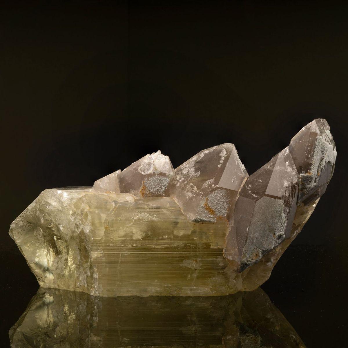 This lustrous formation features hefty terminations of smoky quartz on a large slab of delicately hued, strikingly gemmy, striated spodumene. A unique, visually arresting piece for the collector who has everything.

Dimensions: 9-3/4
