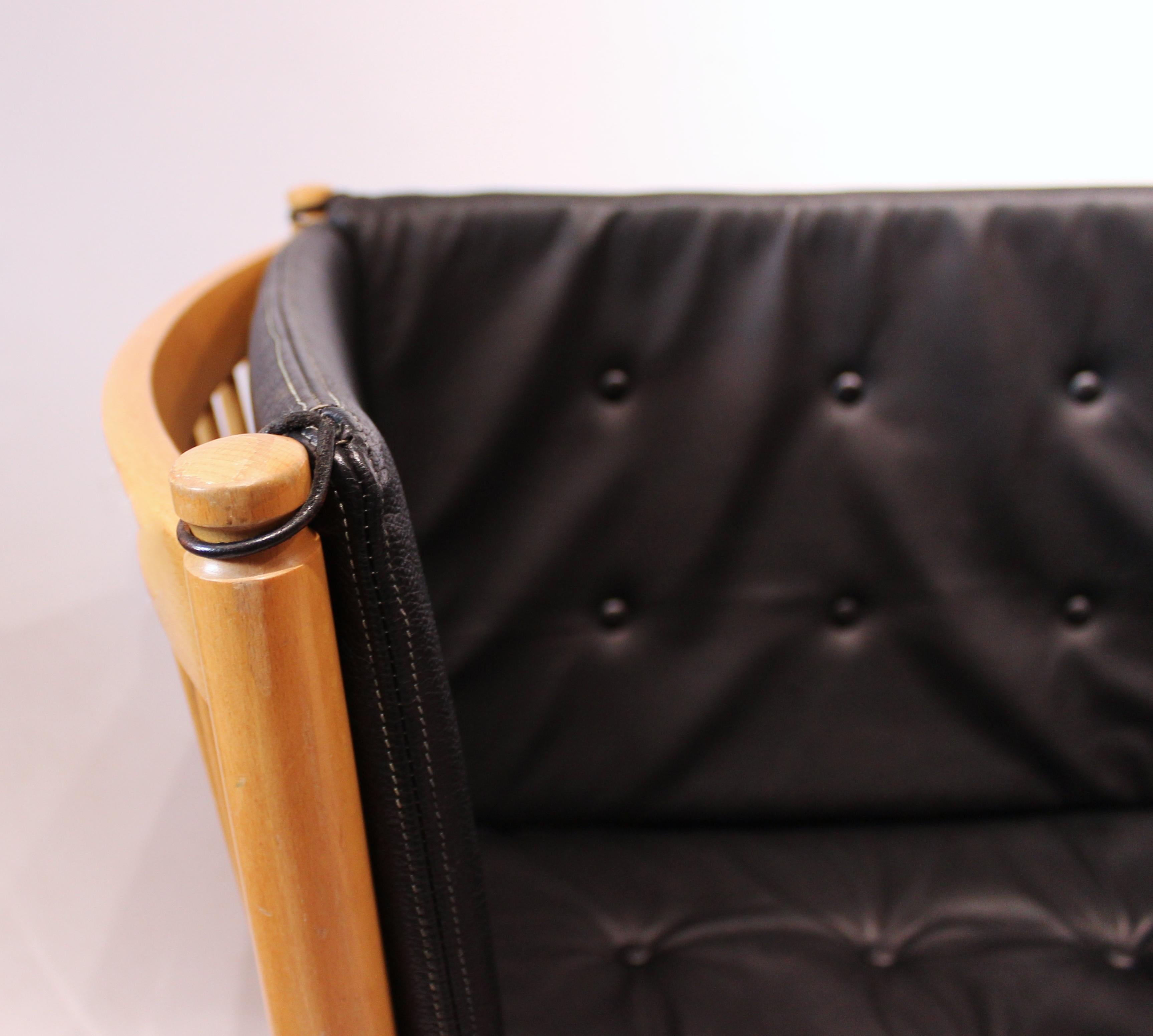 Scandinavian Modern Spokeback sofa in beech and classic black leather, by Børge Mogensen, 1985