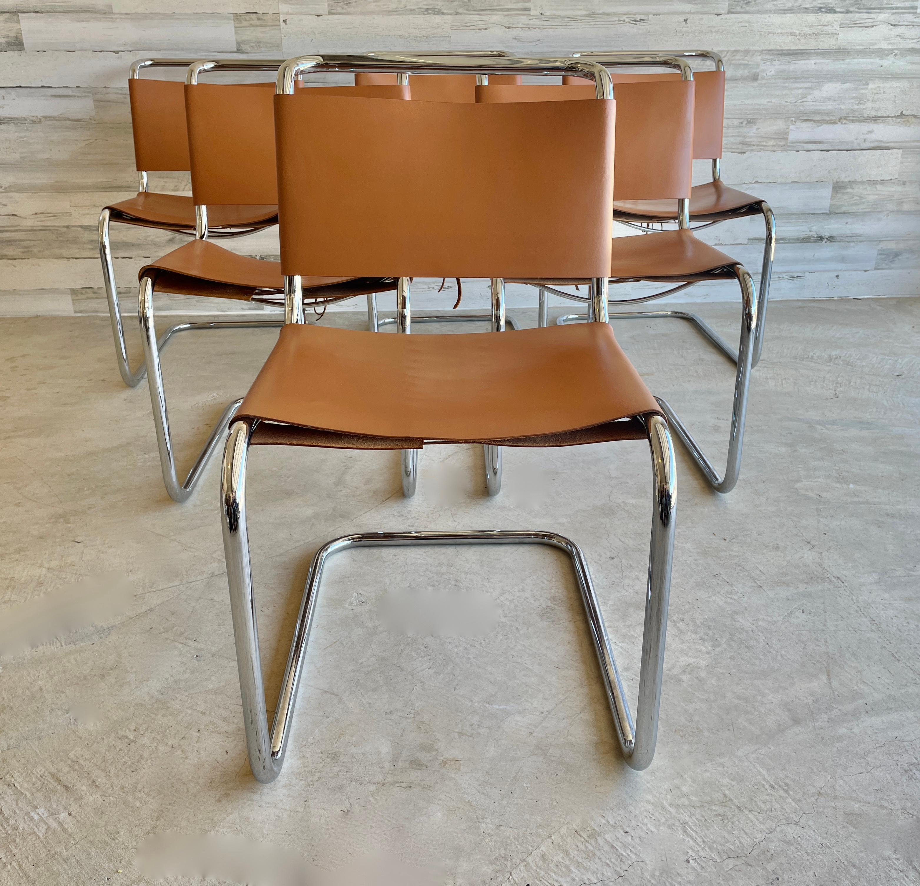 Spoleto dining chairs attributed to Knoll. Cognac colored leather and Kodiak laces on a chrome cantilever frame.