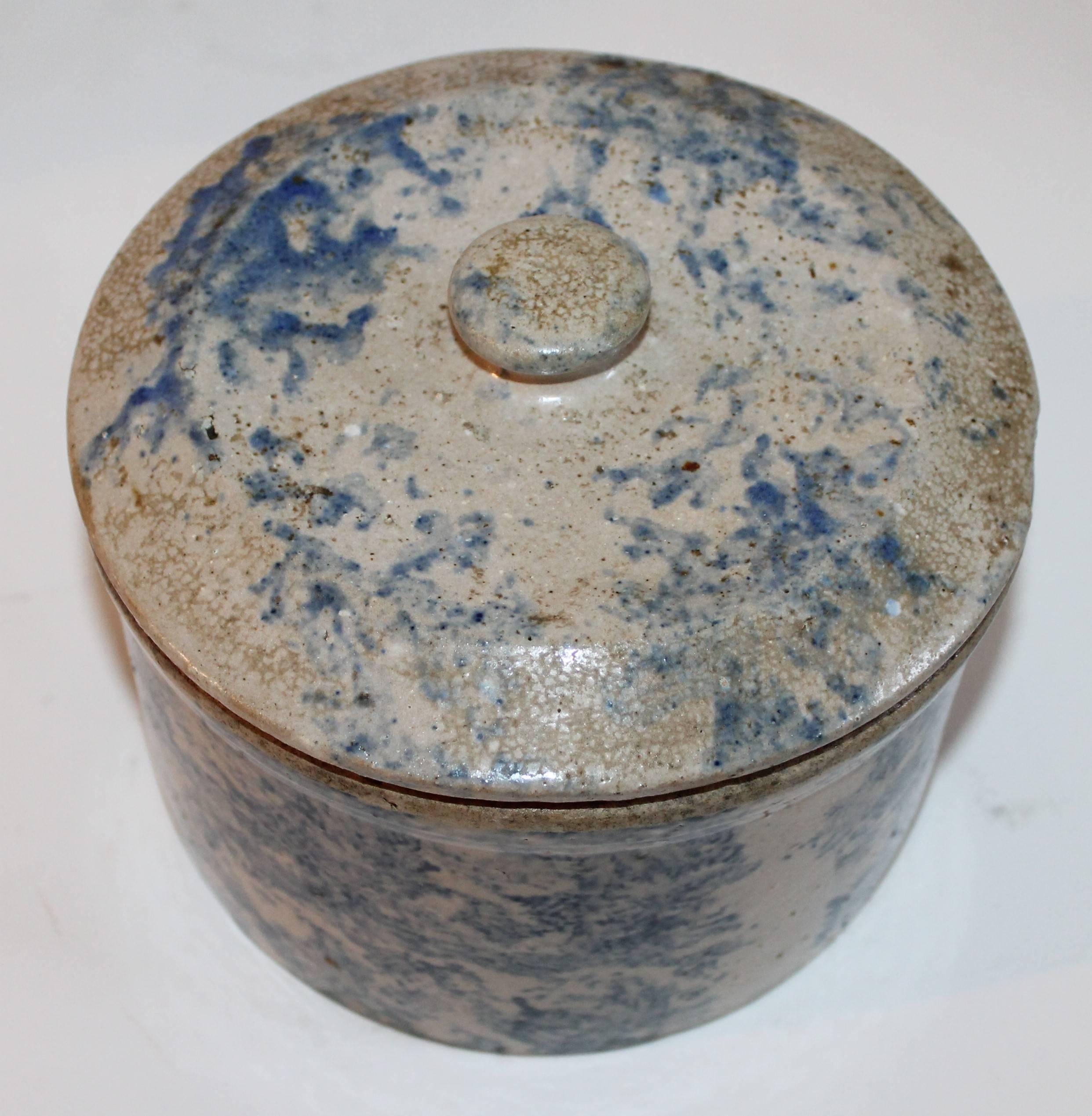 This very rare 19th century sponge decorated salt crock has the original lid and in very good condition. Most unusual salt glaze surface.