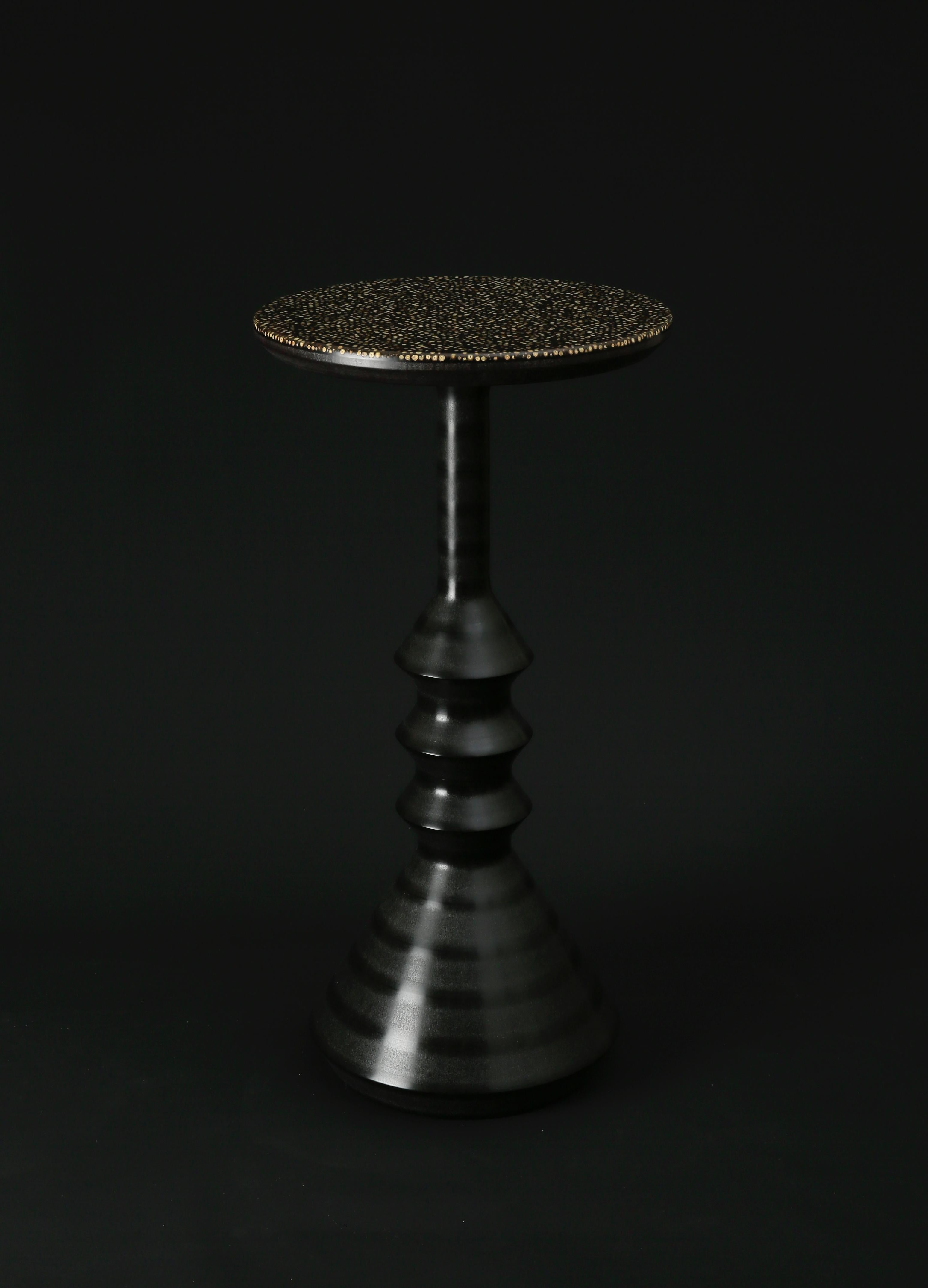 'Spool' is a collection of side tables featuring the 'Piper' peppercorn surface in a range of new colourways. Piper is a composite surface made in several layers incorporating real whole peppercorns and tinted and clear resins. The pleasing