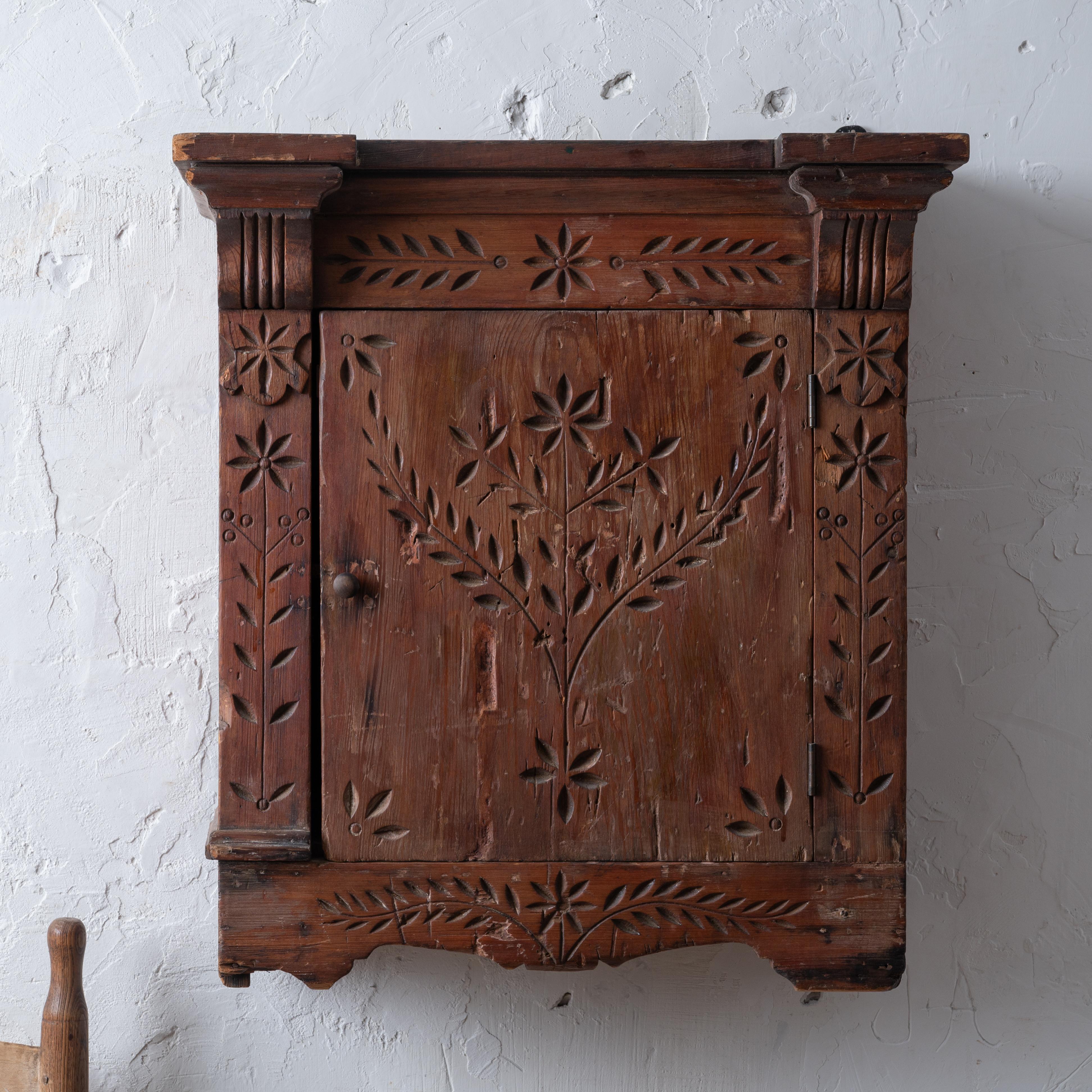 A spoon-carved pine hanging wall cupboard, 19th century.



22 ½ inches wide by 11 inches deep by 24 ¾ inches tall



