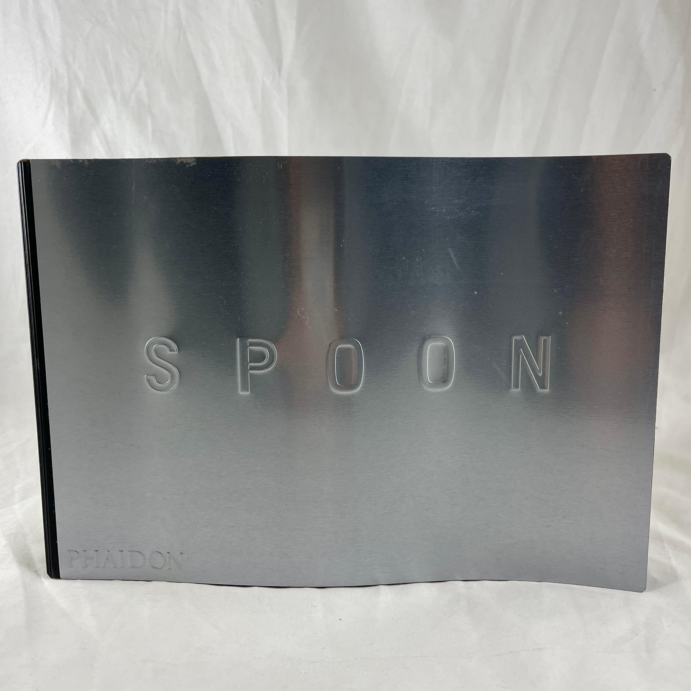 “Spoon” Designed by Mark Diaper, Phaidon Press, 1st Edition 2002

This is the out of print polymer coated Steel version with a cover bent like the silhouette of a spoon.

An award winning catalogue showcasing 100 contemporary industrial designers