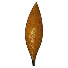 Large curved black and yellow textured spoon sculpture in stock