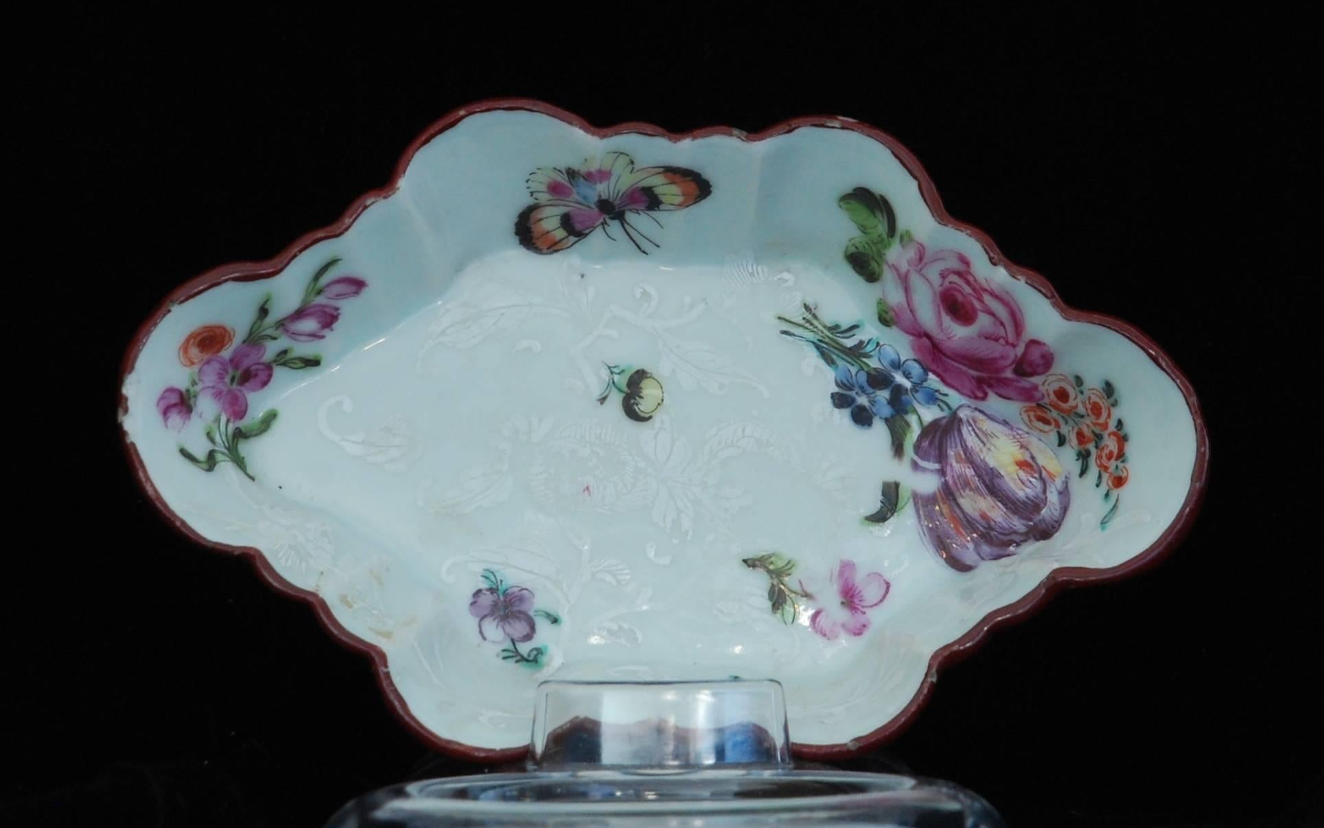 Chinese porcelain with white enamel decoration, enameled in the Giles studio with polychrome flowers and insects. The original white decoration can be seen under the enameling; Giles redecorated Chinese porcelain to suit the English