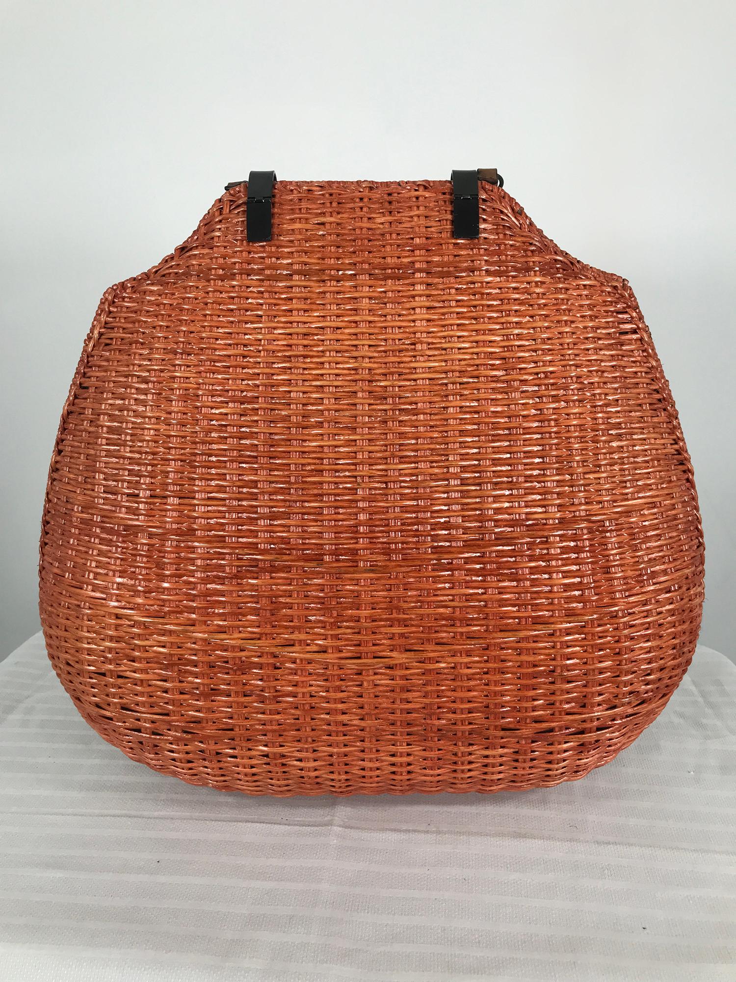 Sport Max giant orange wicker handbag or shoulder bag with leather handle and removable shoulder strap, gunmetal, leather and faux tortoise hardware, There is a single emerald cut crystal rhinestone on the handle side. The interior is lined in black