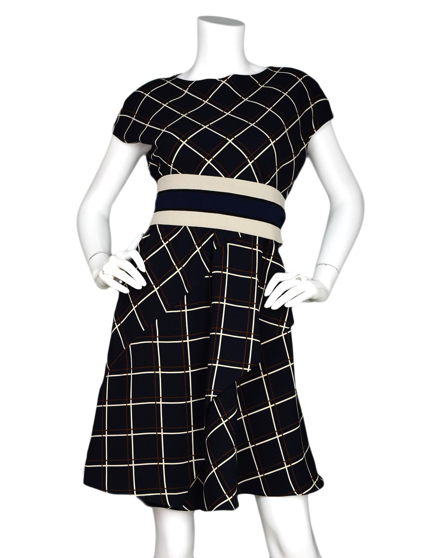 Sportmax Navy Windowpane Print Dress W/ Attached Belt Sz 0 

Made In: Morocco 
Color: Navy, white, tan, burgundy 
Materials: 100% polyester, knitted belt- 85% polyester, 13% nylon, 2% elastane 
Lining: 100% polyester
Opening/Closure: Hidden side