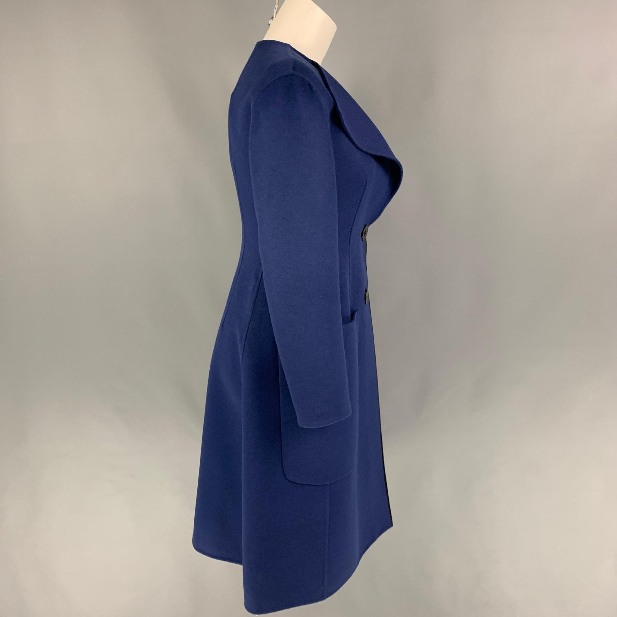 SPORTMAX coat comes in a blue virgin wool / angora featuring a large lapel, satin trim, patch pockets, and a double button closure.  

New With Tags. 
Marked: 2
Original Retail Price: $2,450.00

Measurements:

Shoulder: 16 in.
Bust: 30 in.
Sleeve: