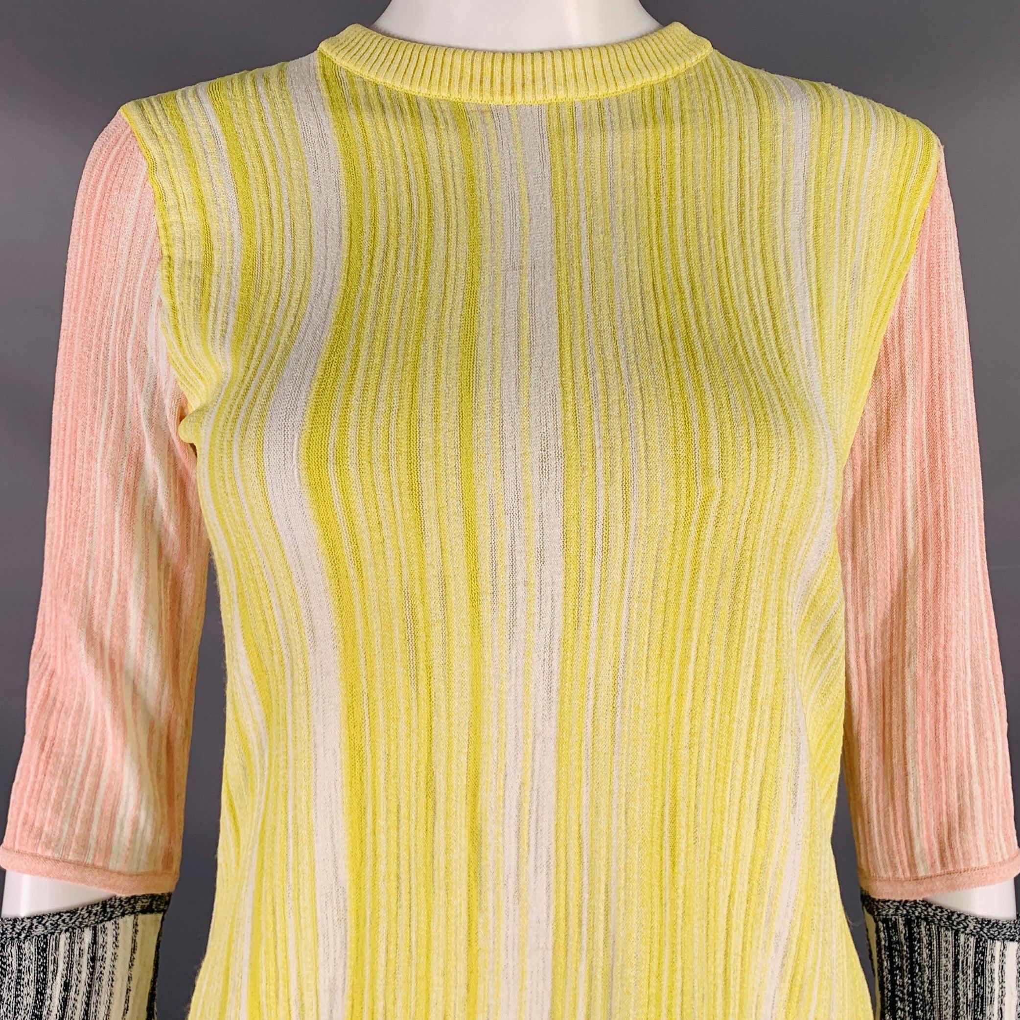 SPORTMAX casual top
in a
yellow and pink rib knit featuring a color block style, cut off sleeves, and crew neck. Made in Italy.Very Good Pre-Owned Condition. Minor marks, fabric tags removed. 

Marked:   size not marked 

Measurements: 
 
Shoulder: