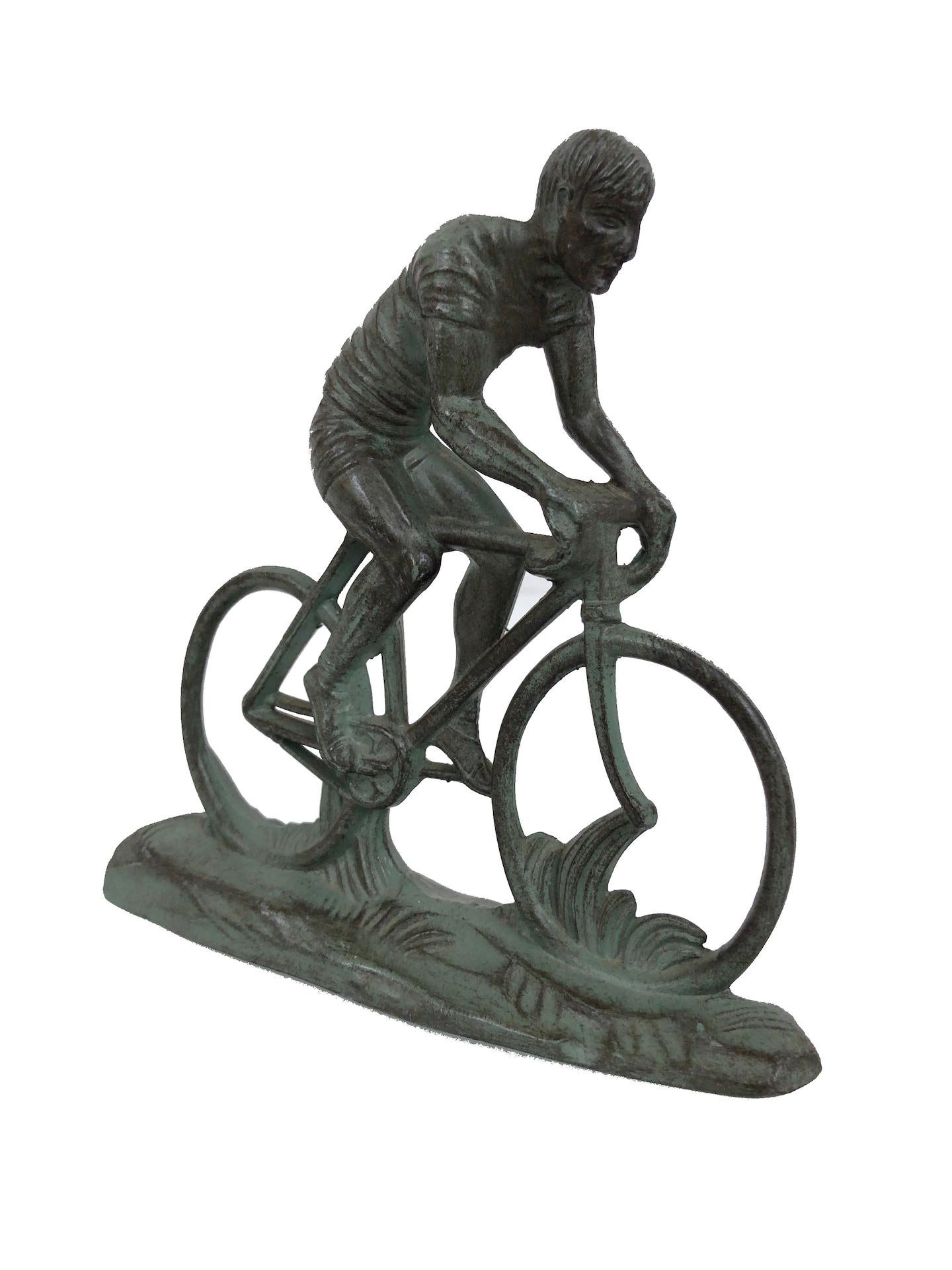 Sculpture in spelter 
Sportsman on a racing bicycle 
Original patina 
Original Art Deco, France, 1930s. 

Dimensions:
Width 12 cm
Height 12 cm
Depth 3 cm.