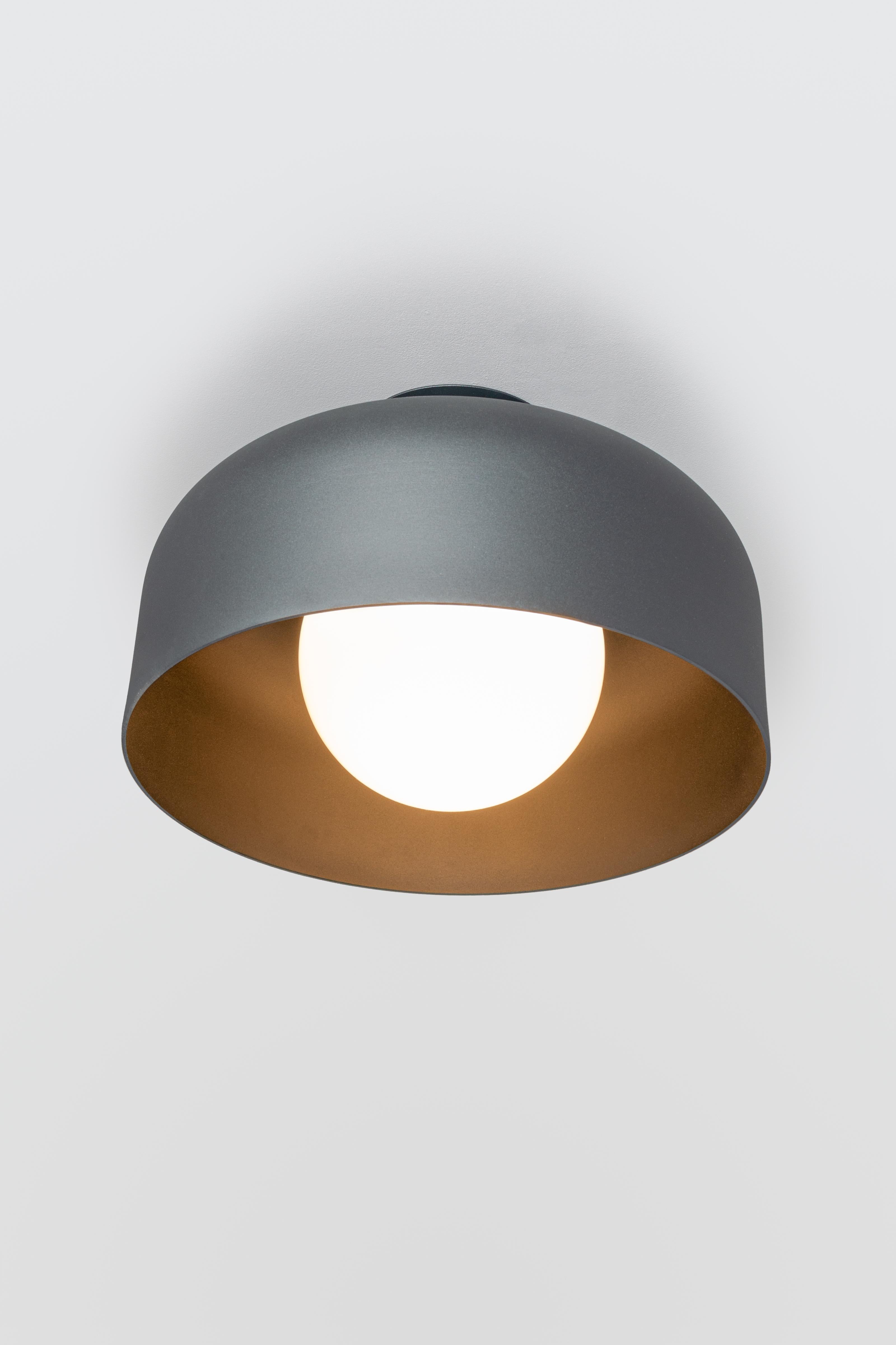 SPOTLIGHT VOLUMES, ceiling lamp / wall lamp
Design: Lukas Peet, Editor: ANDLight
UL Listed

Model shown: E

The Spotlight Volumes series shows five unique spun aluminum shade profiles that range from wide to narrow, creating various distinct
