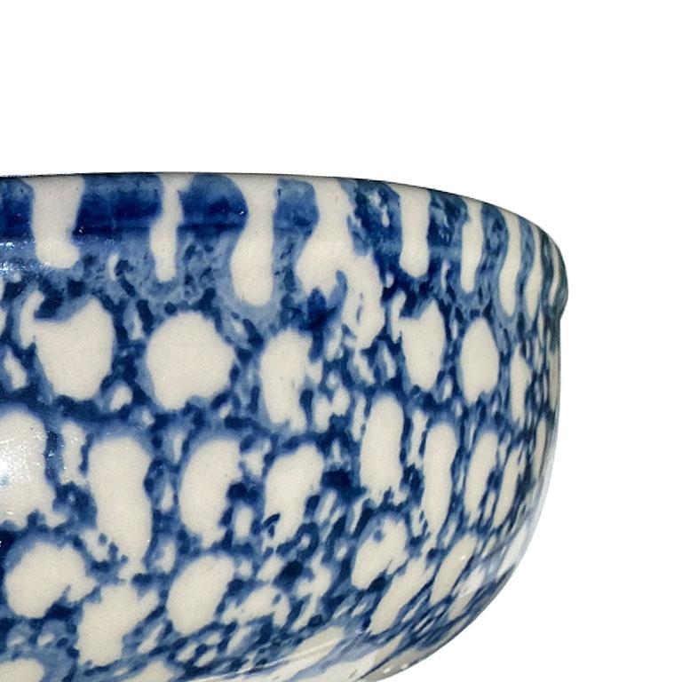 A blue and white spotted stoneware bowl. 

Dimensions:
8.75