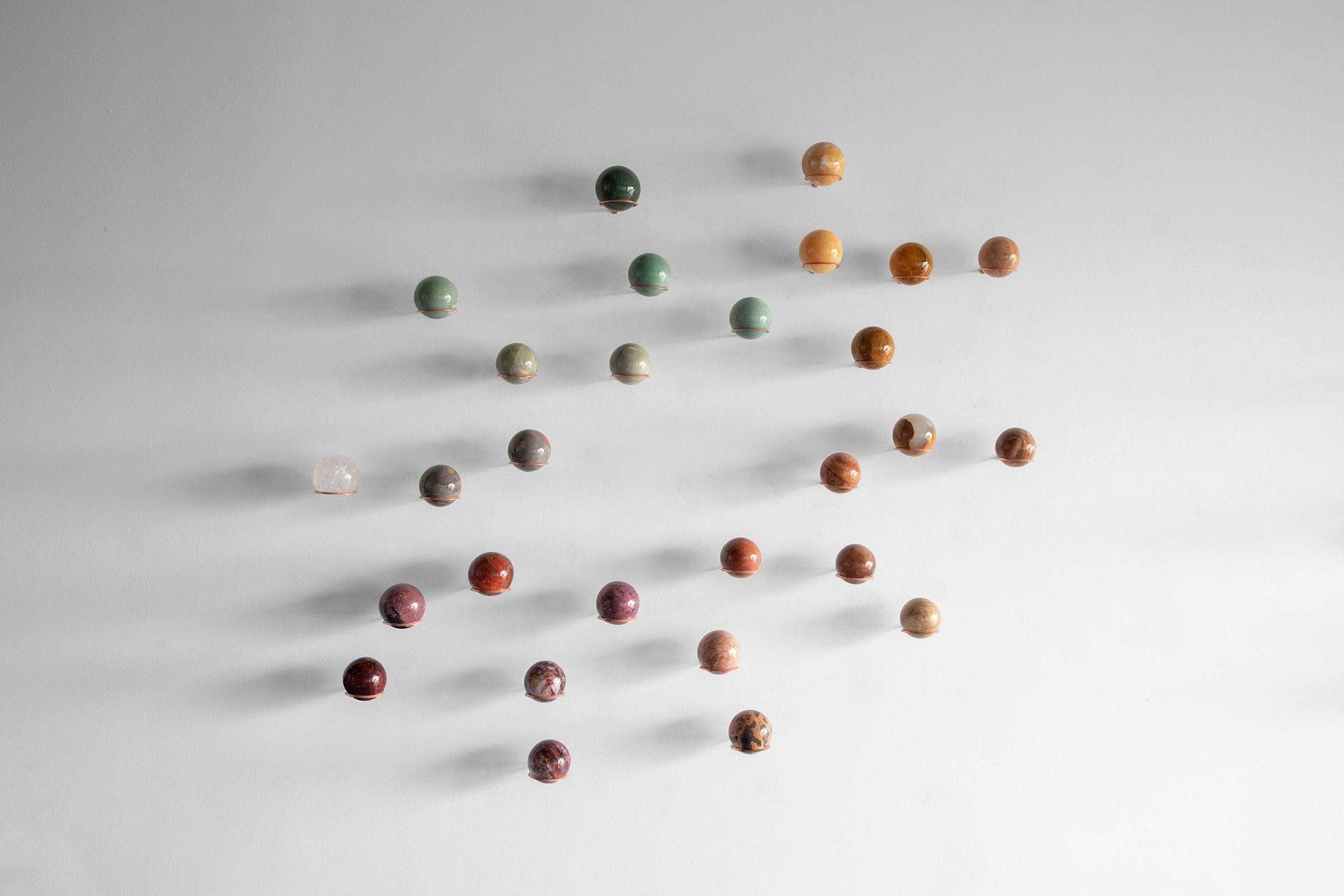 Semi-precious stones, metal holder
Composition dimensions: 157.4” W x 4.2” D x 29.1” H / 400 W X 10.9 D x 74 H cm
Edition of 15
Set of 22 spheres

**We can custom color pallet in the composition**
***Colors and textures may vary due the uniqueness