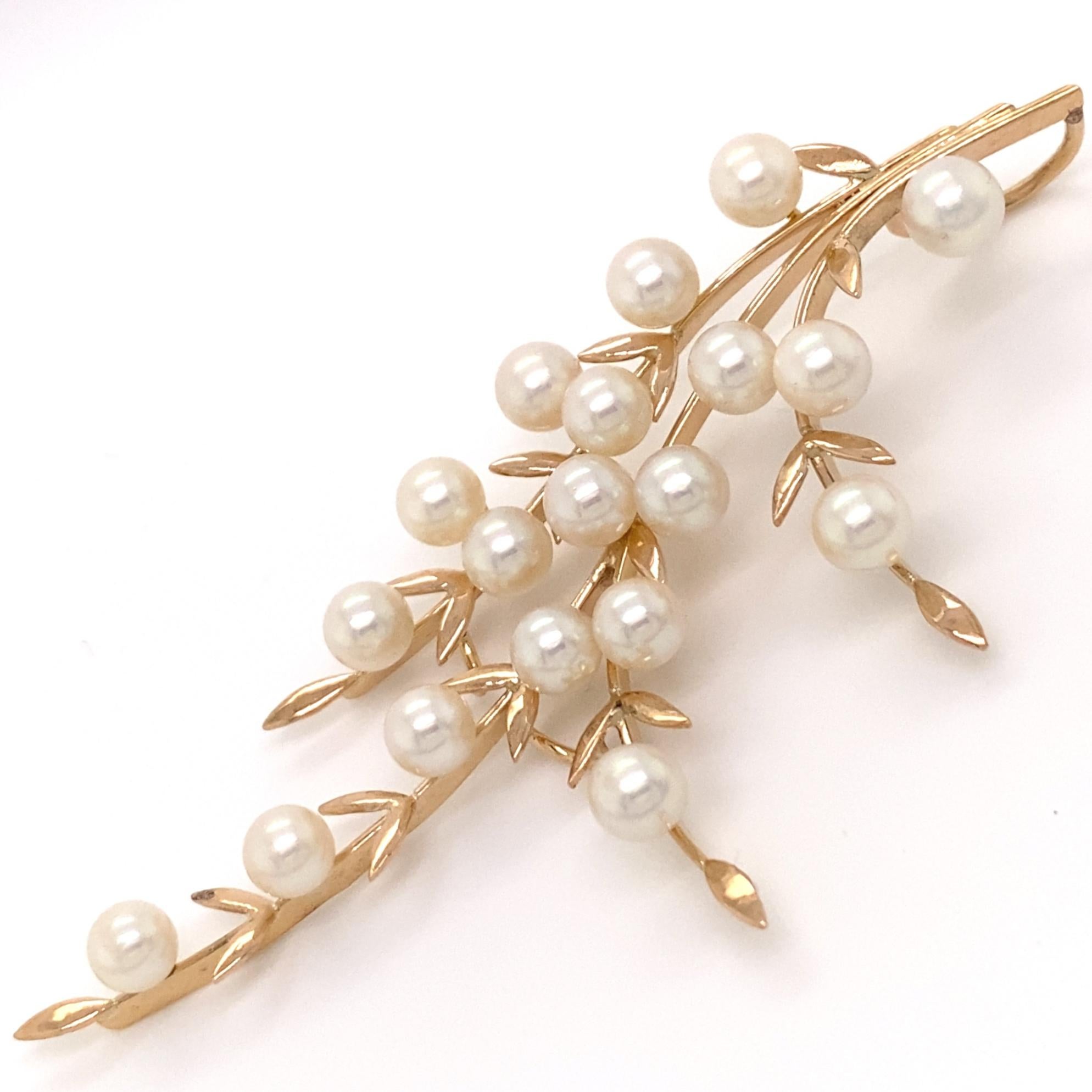 Eytan Brandes converted this 1970s pearl spray brooch to a pendant.  

As a pin, it demurely announced 