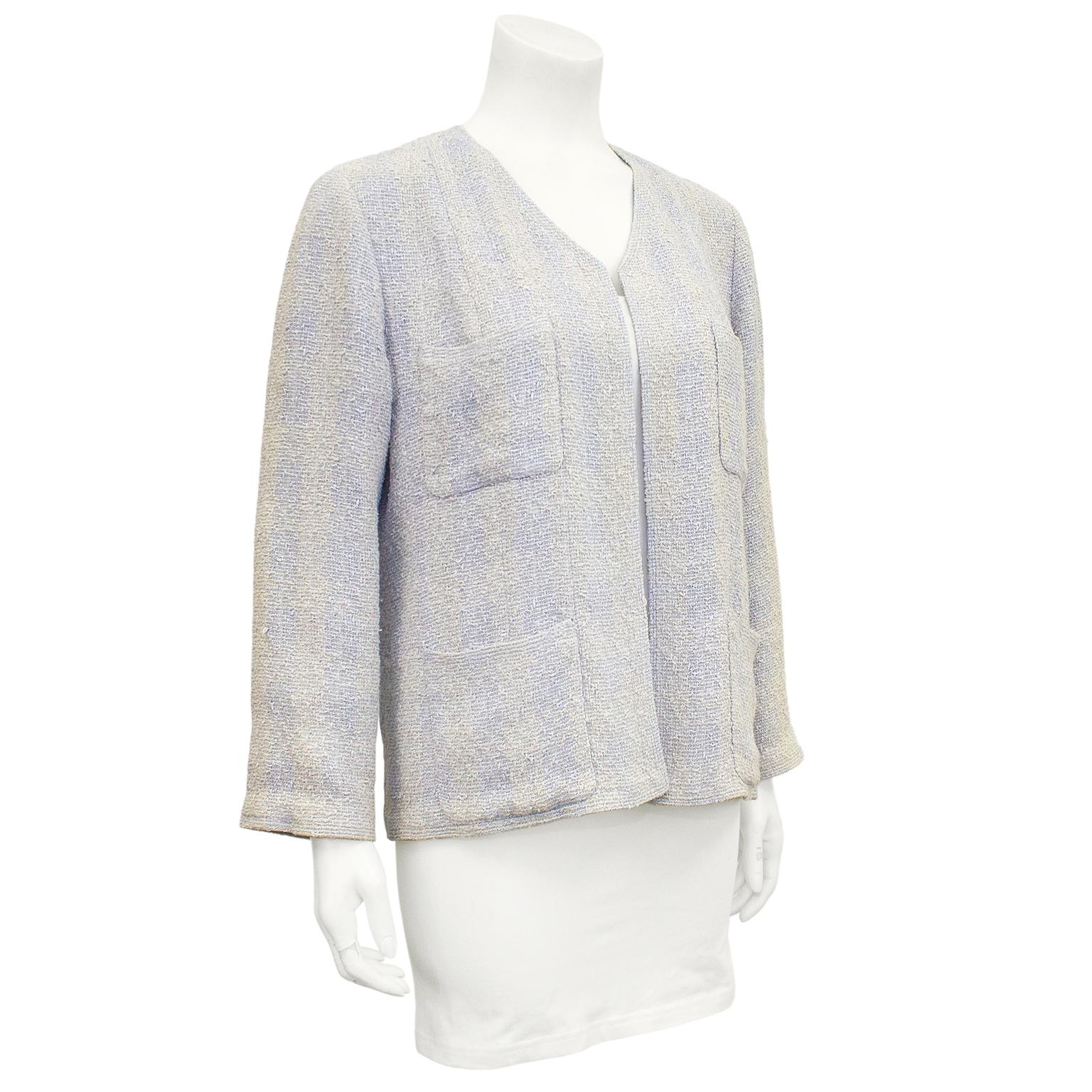 Beautiful Chanel beige and pale blue knit wool tweed ombre jacket from the spring 1999 collection. High v shaped neckline, open front and patch pockets at bust and hips. Loose through body, giving it a more casual vibe. Small silver Chanel plaque at