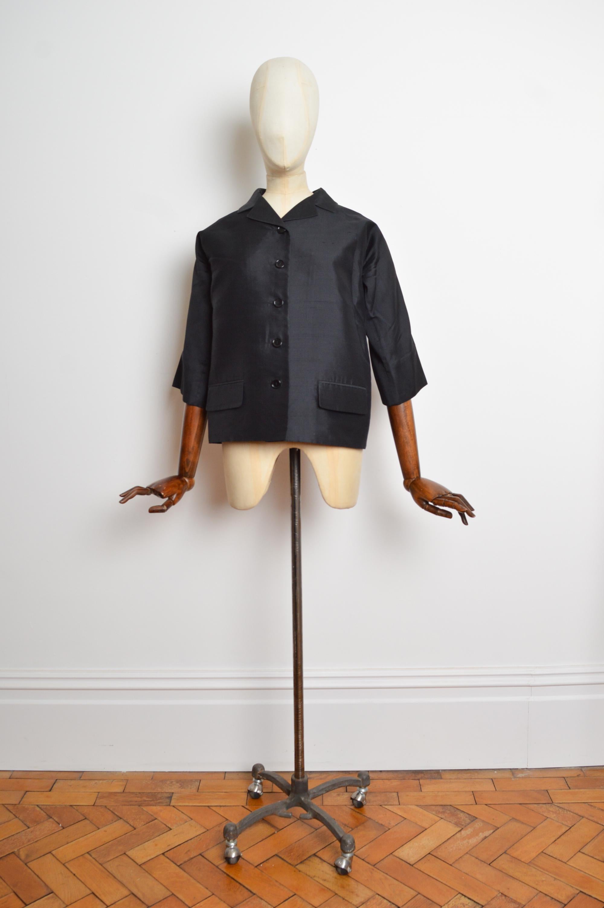 Timeless Spring 1999 Dolce & Gabbana runway jacket featuring an elegant 3/4 sleeve cut, cocoon shape and button closure down the front. 
Size; U.K. 8-10
Measurements are provided in inches (‘’)
Pit to Pit; 20”
Pit to Cuff; 12”
Nape to Hem;