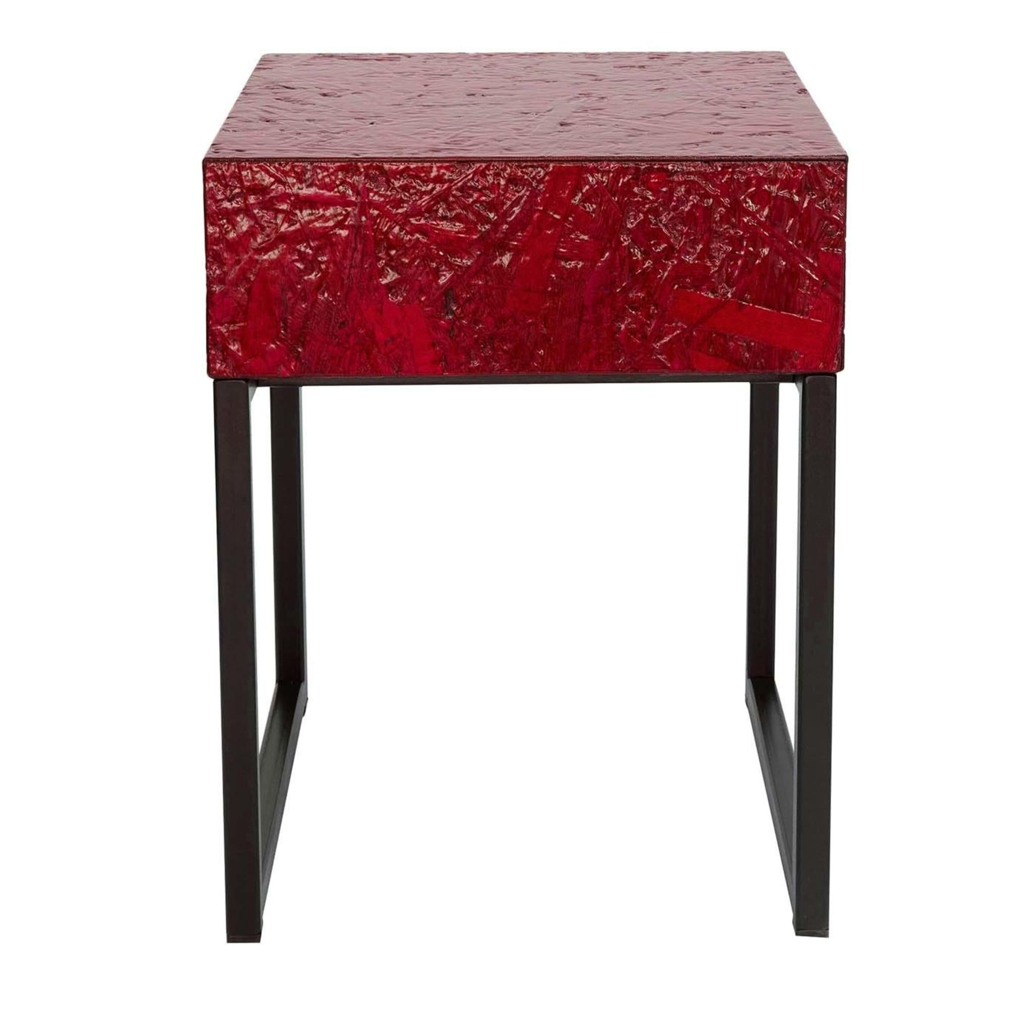 A convenient and elegant spot for your reading lamp or even doubling as a stool, this bedside table in red designed by Fabrizio Contaldo features a handy drawer and measures 35 cm square and 45 cm in height. Made from glossy OBS with a matt black