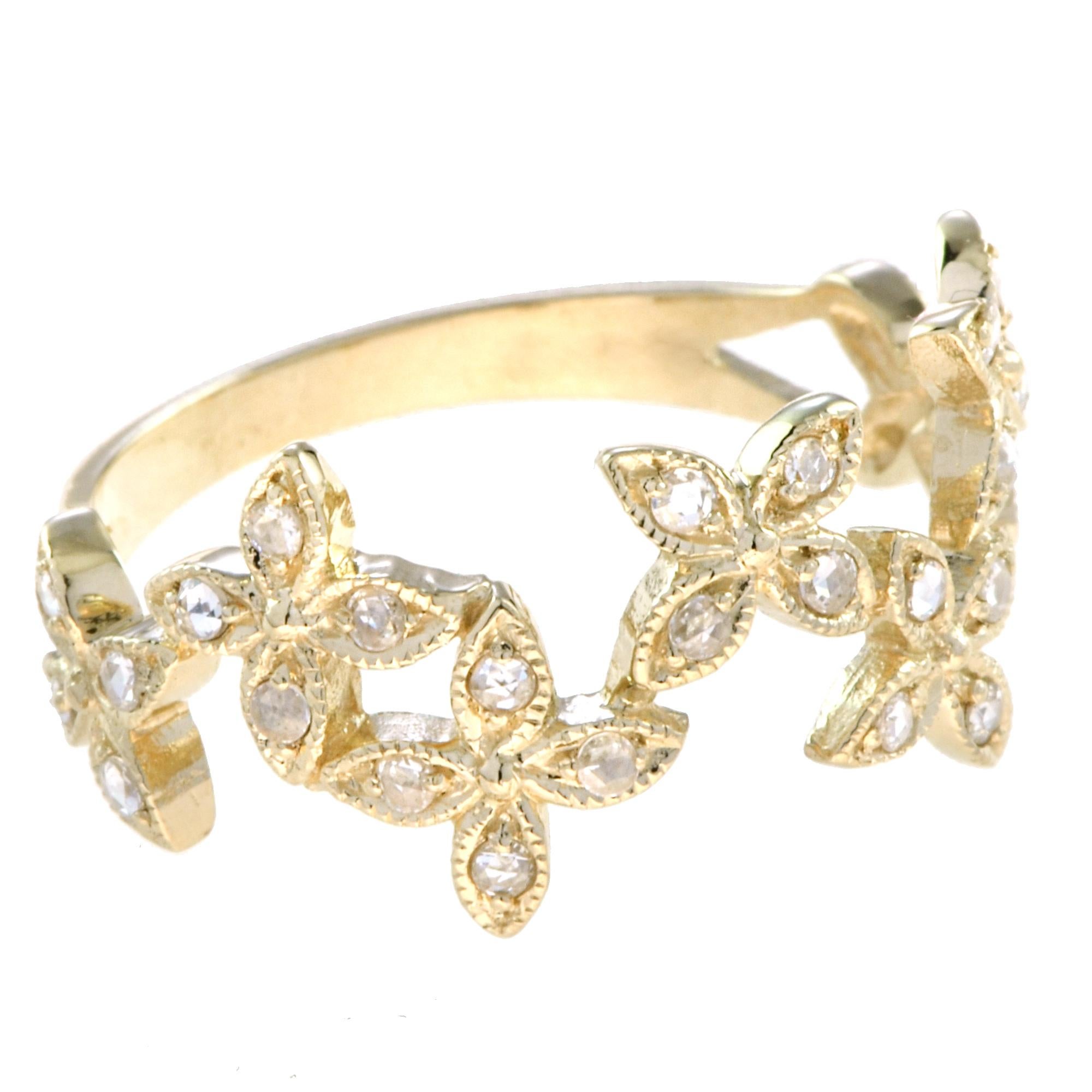 This lovely half eternity ring features round diamonds set within a floral pattern that continues halfway around the yellow gold band. Every detail of the floral design on this ring is highlighted by lines of milgrain beading, and this adds a