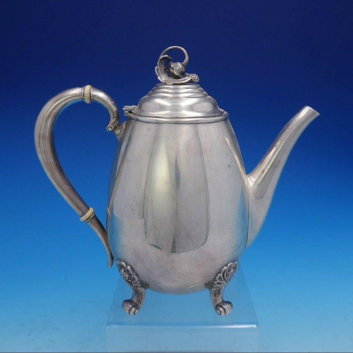 International

Spring Glory by International extra heavy sterling silver 5 piece tea set marked #C360. The coffee pot measures 9