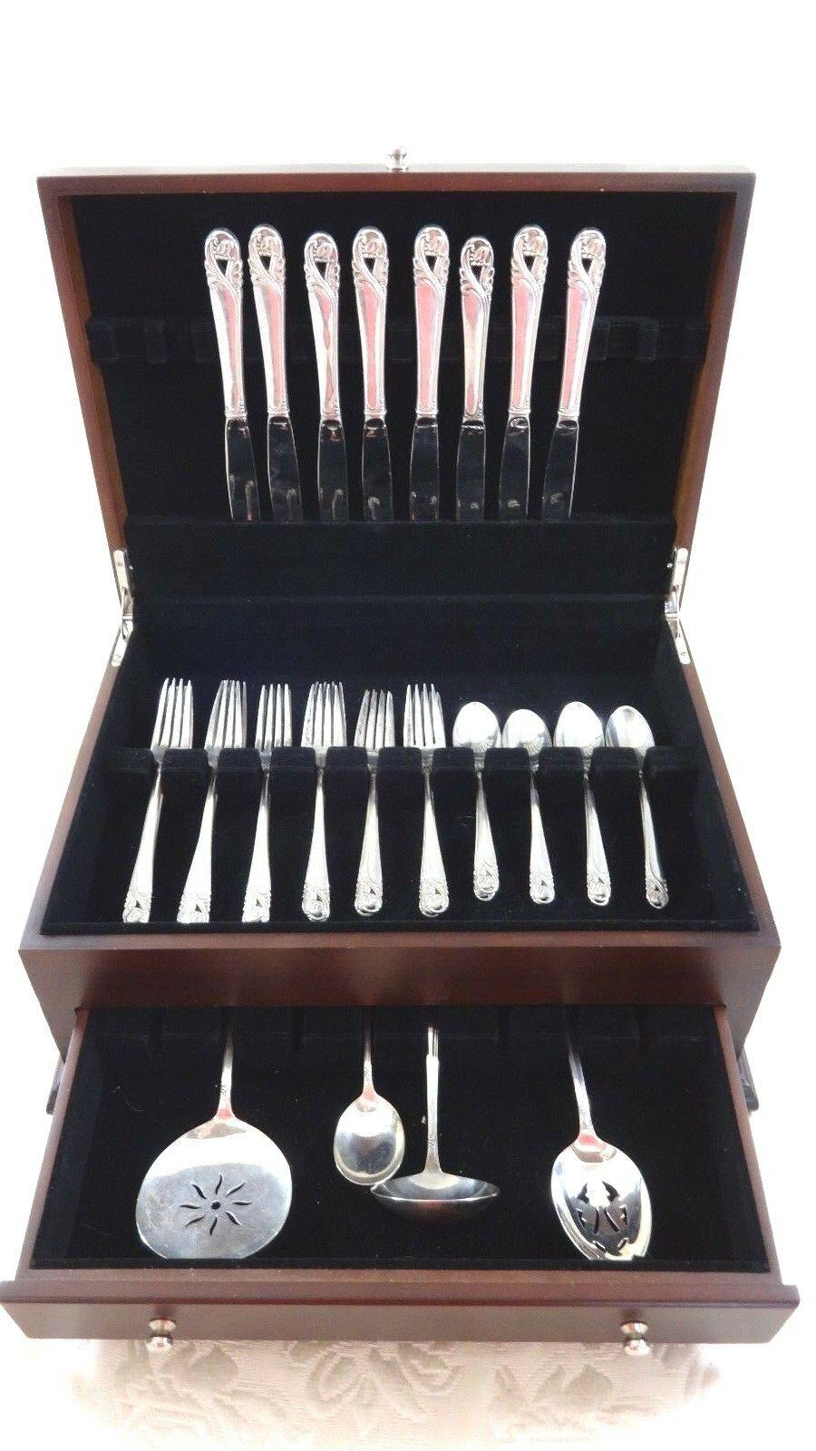 Spring glory by International Sterling Silver flatware set - 36 pieces. This set includes:

8 knives, 9 1/4