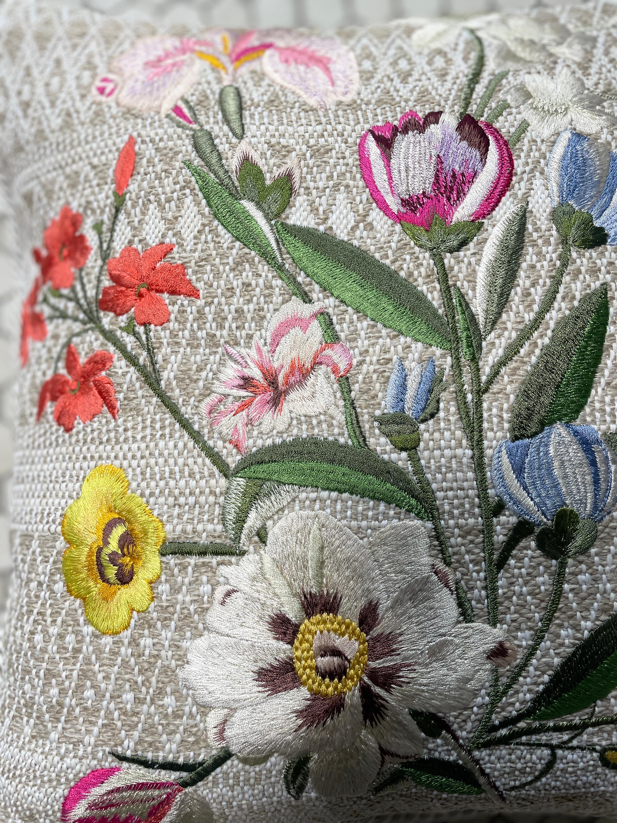 Vibrant hues of silk threads are hand embroidered into an elegant botanical bouquet. Fuchsia poppies , pastel blue lilies and irises bloom on the beige heavy cotton with geometric natural colored pattern. The back side of the cushion is in quilted