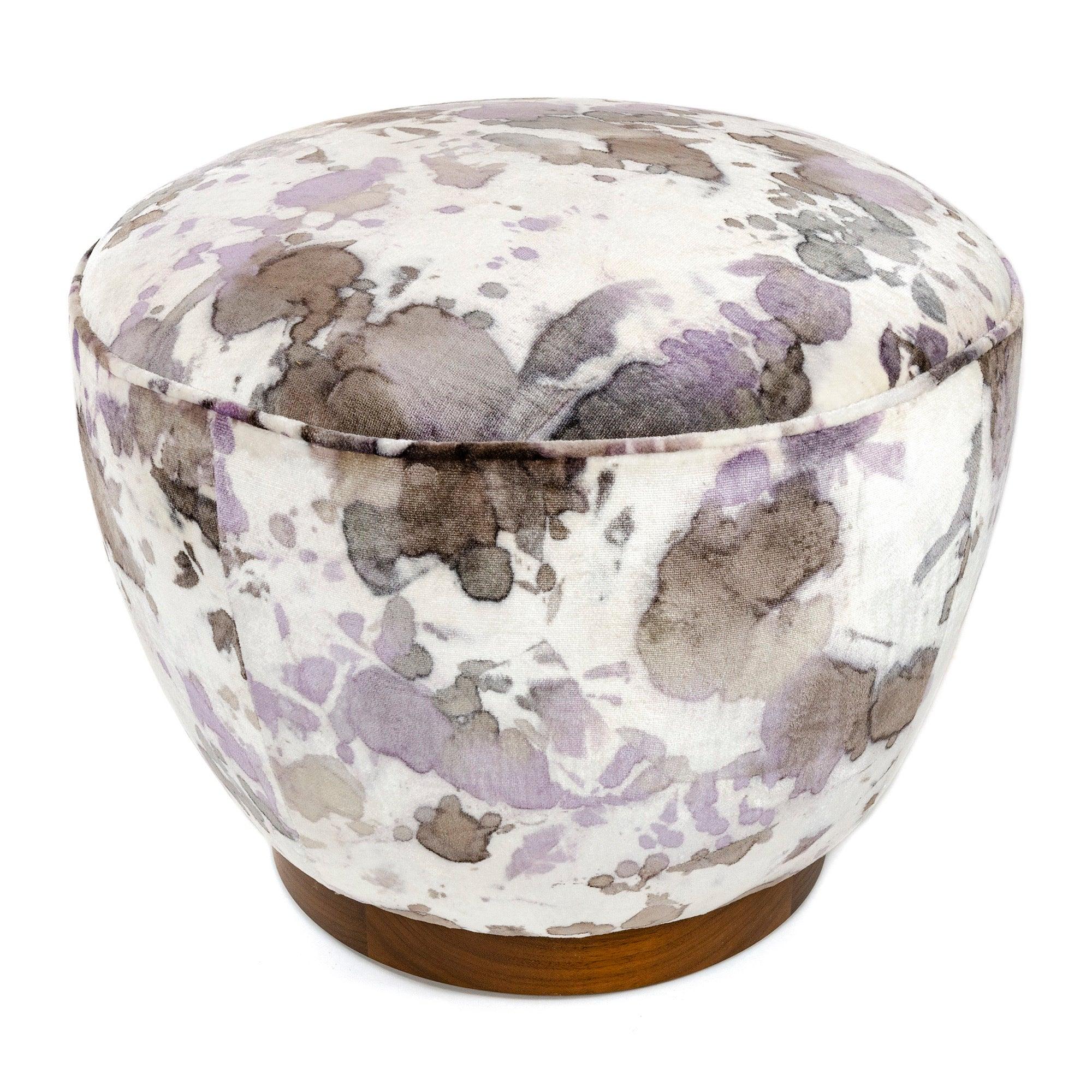 A traditional hand crafted and tied coil spring pouf ottoman with an oiled walnut base in Knoll Luxe fabric.