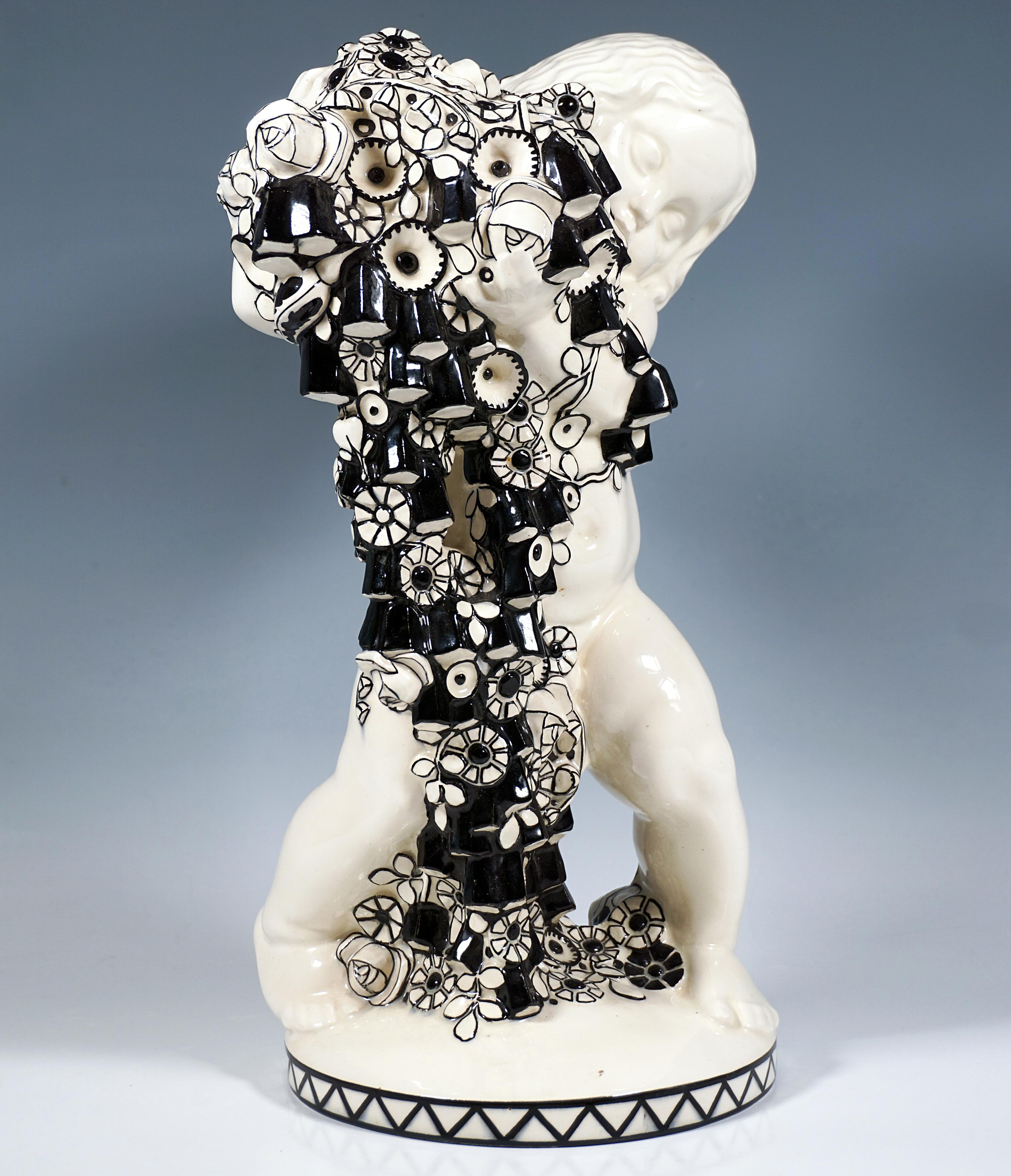 Excellent and rare Art Nouveau ceramic piece from a series of the four seasons:
Naked putto in a wide stance, head tilted to the left and holding a cascade of flowers falling to the floor in his arms.
On a slightly curved, round flat base with