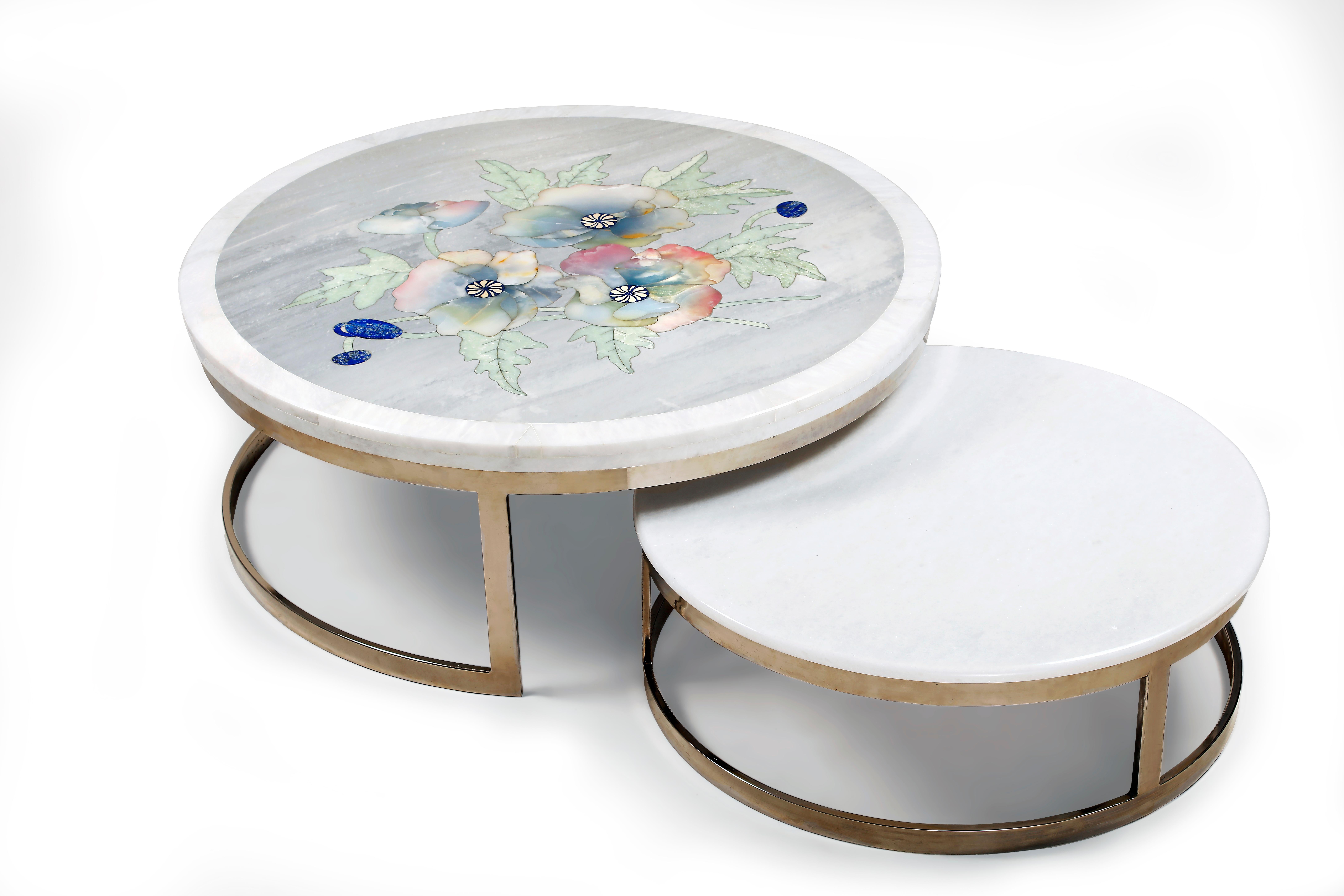Spring rain nesting tables by Studio Lel
Dimensions: D107 x W107 x H41 cm , D91 x W91 x H36 cm
Materials: Lapis lazuli, onyx, jade, marble, chrome.

Taking its name from the Majorelle Garden in Marrakech, which was painted entirely by Jacques