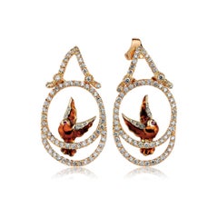 Orecchini pendenti a forma di uccello in oro 18K con diamanti