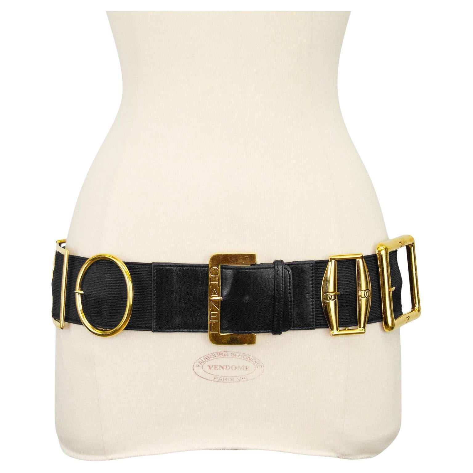 Chanel multibuckle belt from the 1988 Spring/Summer collection. This ultimate statement piece features 10 static buckles and one adjustable buckle on a wide black elasticized belt with leather buckle tabs. All the buckles have a signature CC