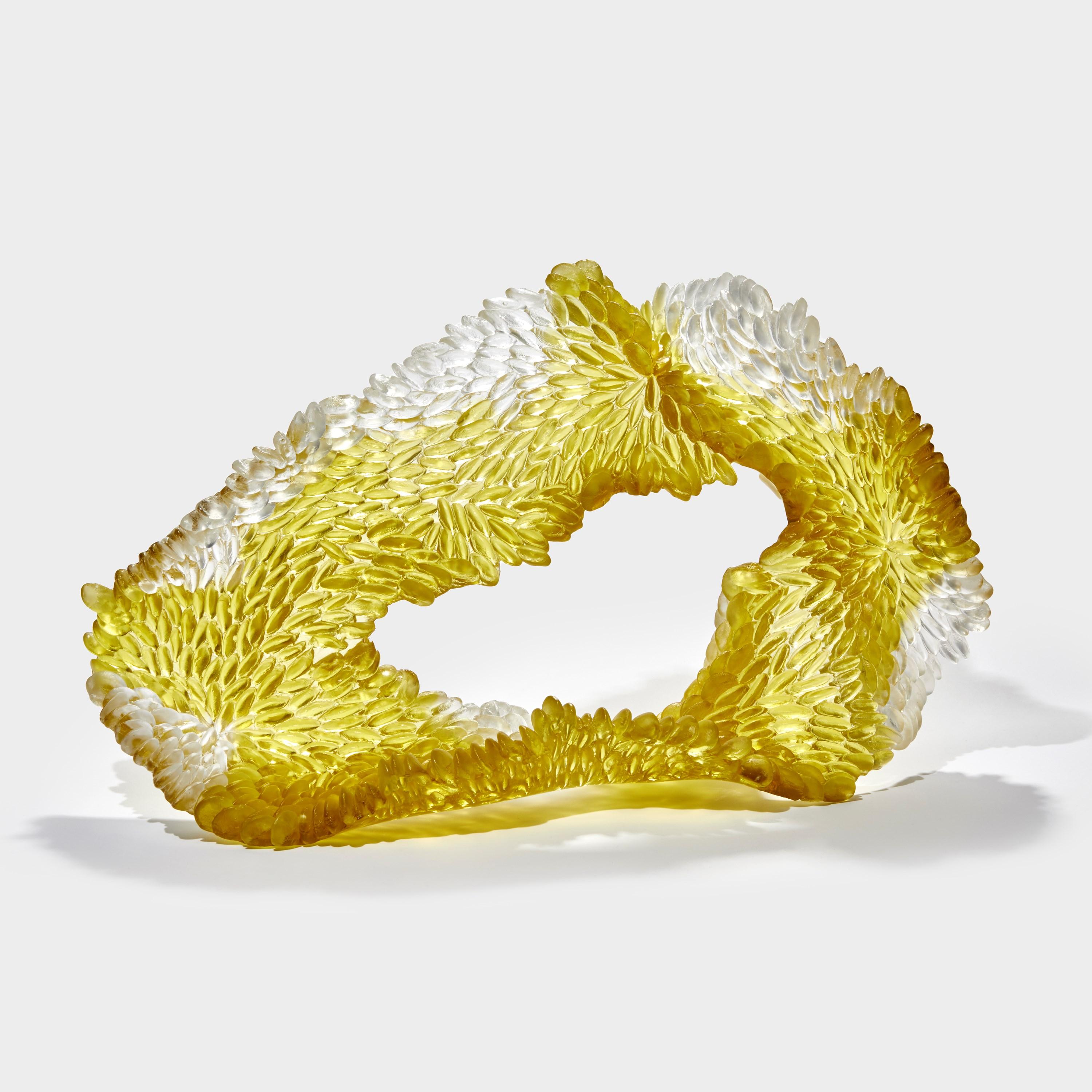 'Spring Yellows I' is a unique glass sculpture by the British artist, Nina Casson McGarva.

Casson McGarva firstly casts her glass in a flat mould where she introduces all of the beautifully detailed, scaled surface texture, all unique and to her