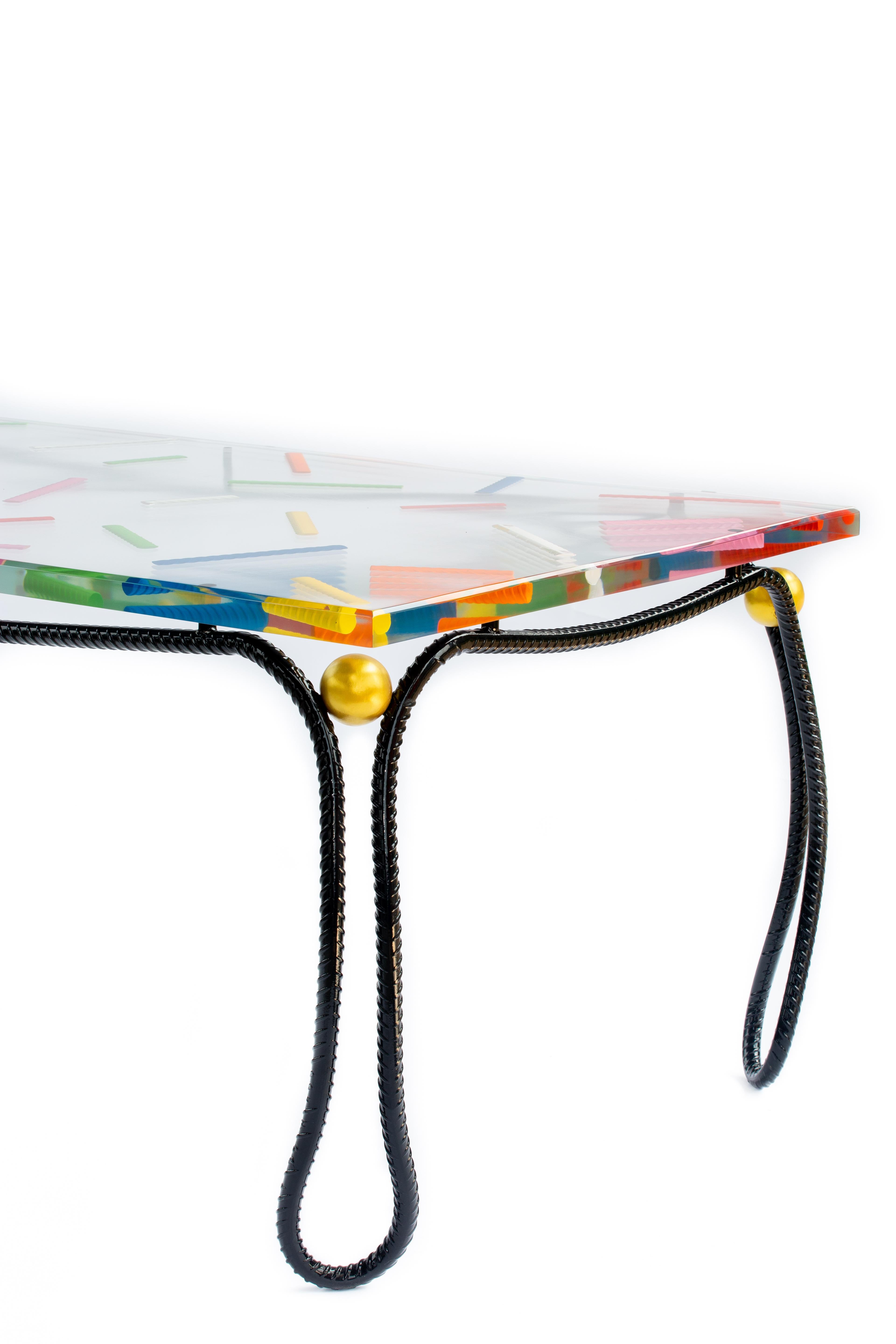 The Sprinkles Rebar dining table is a completely original new work. 

The table's base is made from a one-inch piece of construction rebar that is heated and forged and then hand bent into one continuous flowing line and powder-coated black. The