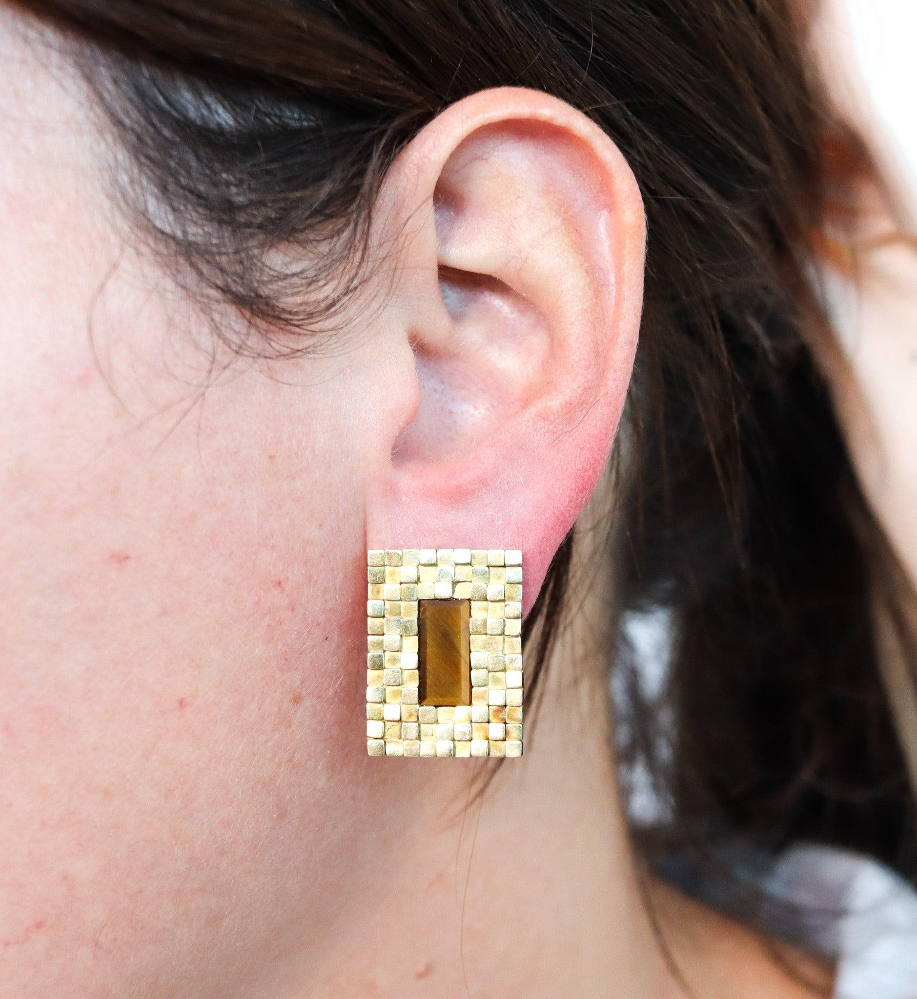 Modernist earrings designed by Spritzer & Fuhrmann.

Stunning sculptural pair of clips earrings, created for the jewelers and retailers Spritzer & Fuhrmann, back in the late 1960s. This pair has been crafted with modernist geometric patterns,