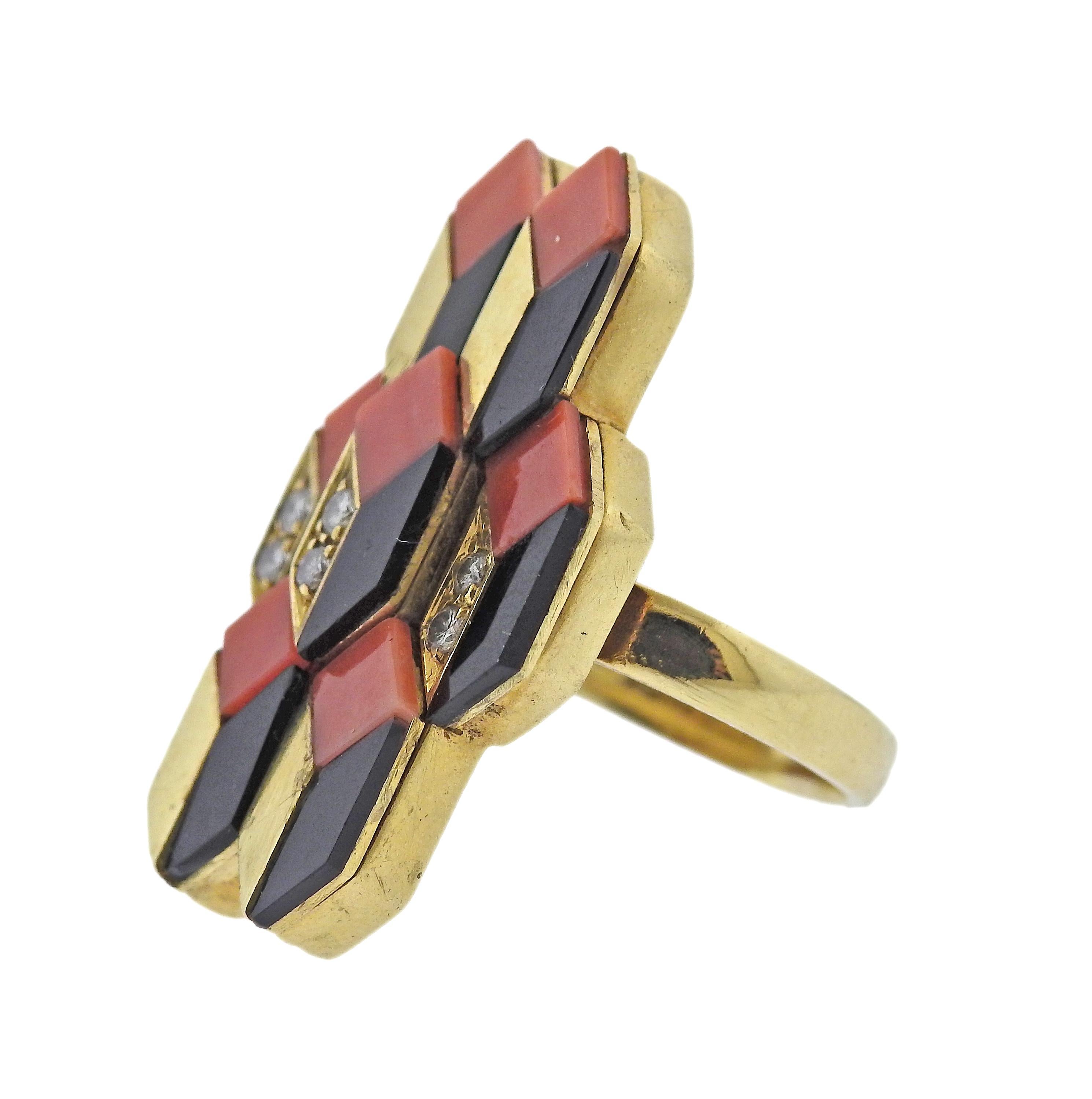 1970s, 18k gold ring by Spritzer & Fuhrmann, set with inlayed coral and onyx, with approx. 0.12ctw H/VS diamonds. Ring size - 6.5, ring top is 31mm x 20mm. Marked: S+F, 18k, 3075, Italy. Weight - 17.6 grams.
