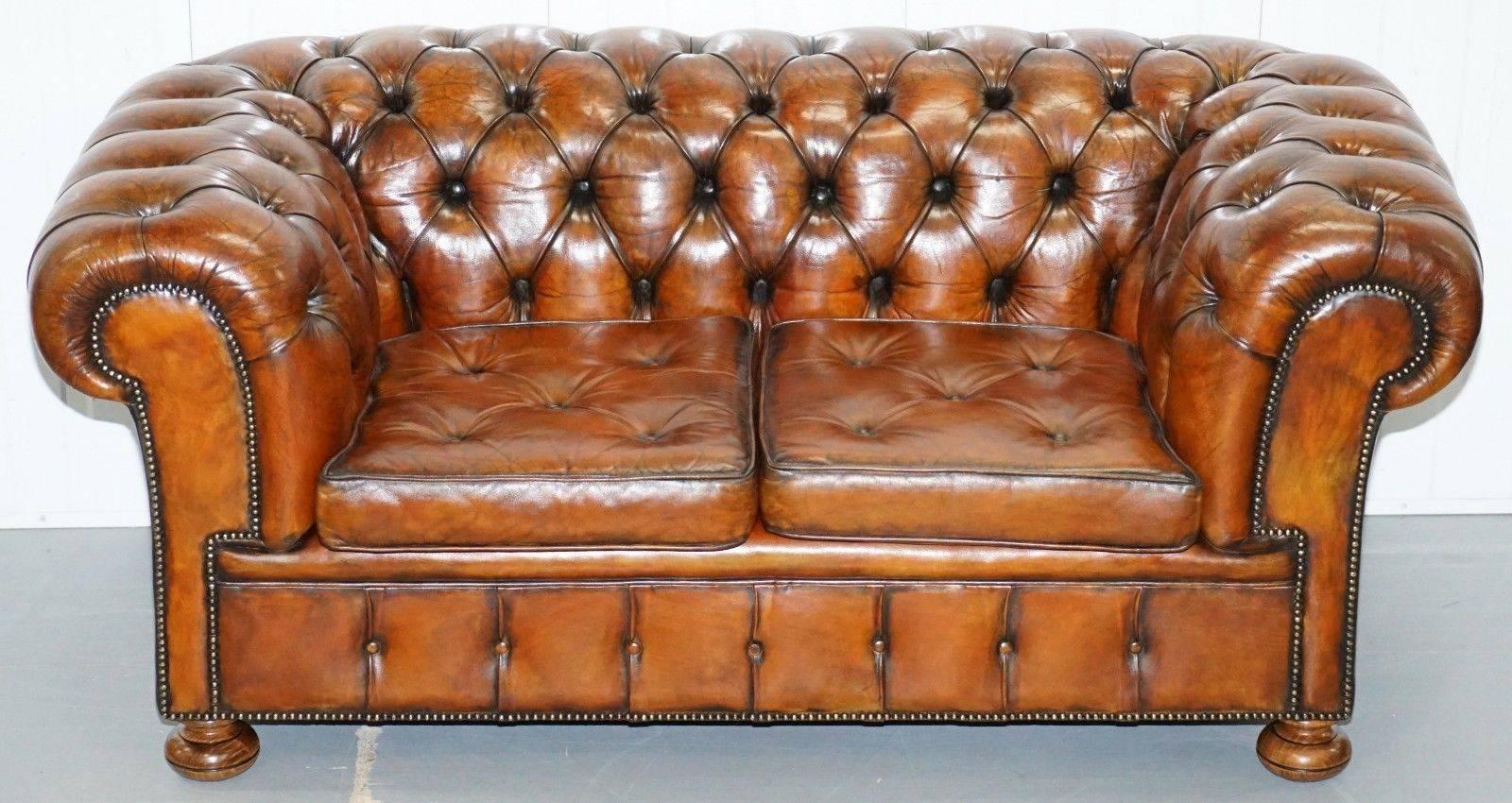 We are delighted to offer for sale this very rare absolutely stunning circa 1930s fully restored Chesterfield aged whiskey brown leather gentleman’s club sofa with Thomas Chippendale style floating buttoned seat cushions.

Where to begin… if