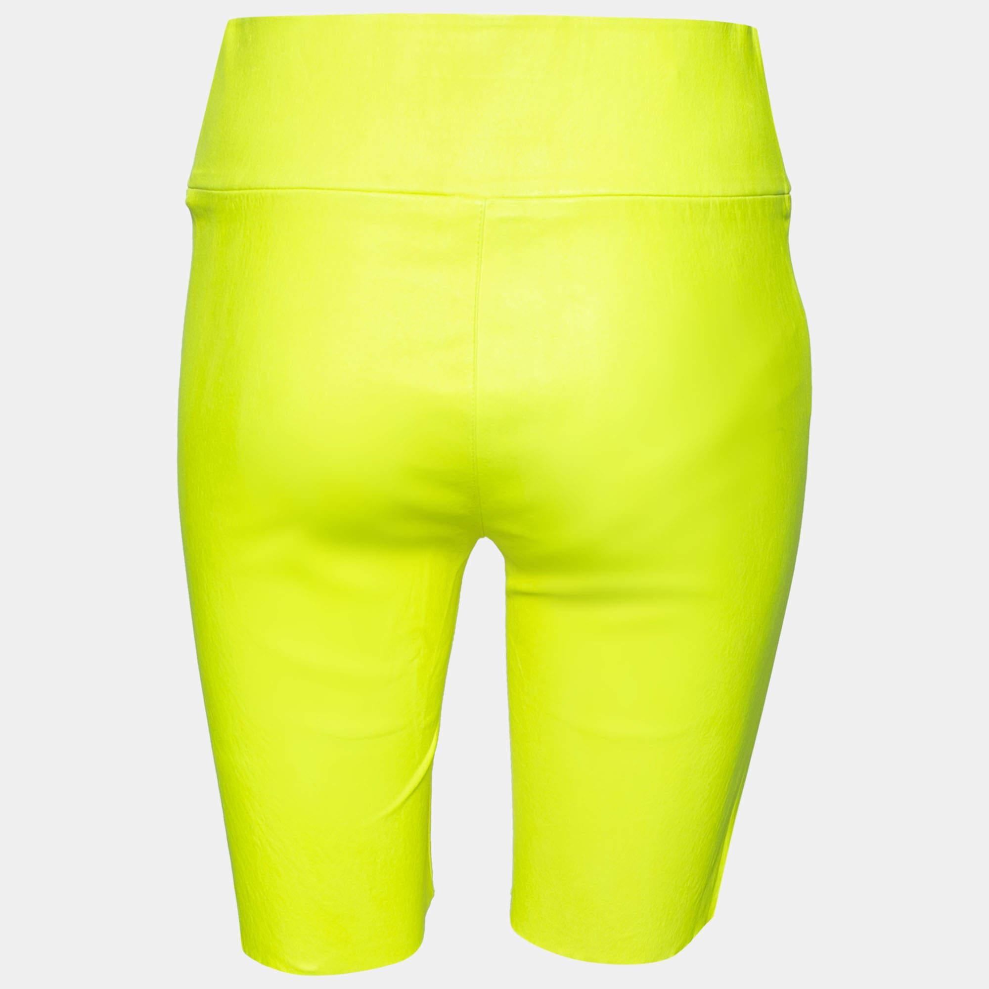 These comfy shorts from Sprwmn are all you need to add to your summer wardrobe They are stitched using neon yellow leather and flaunt a fitted shape. Wear them with a basic tank top and sneakers for that casual chic look.