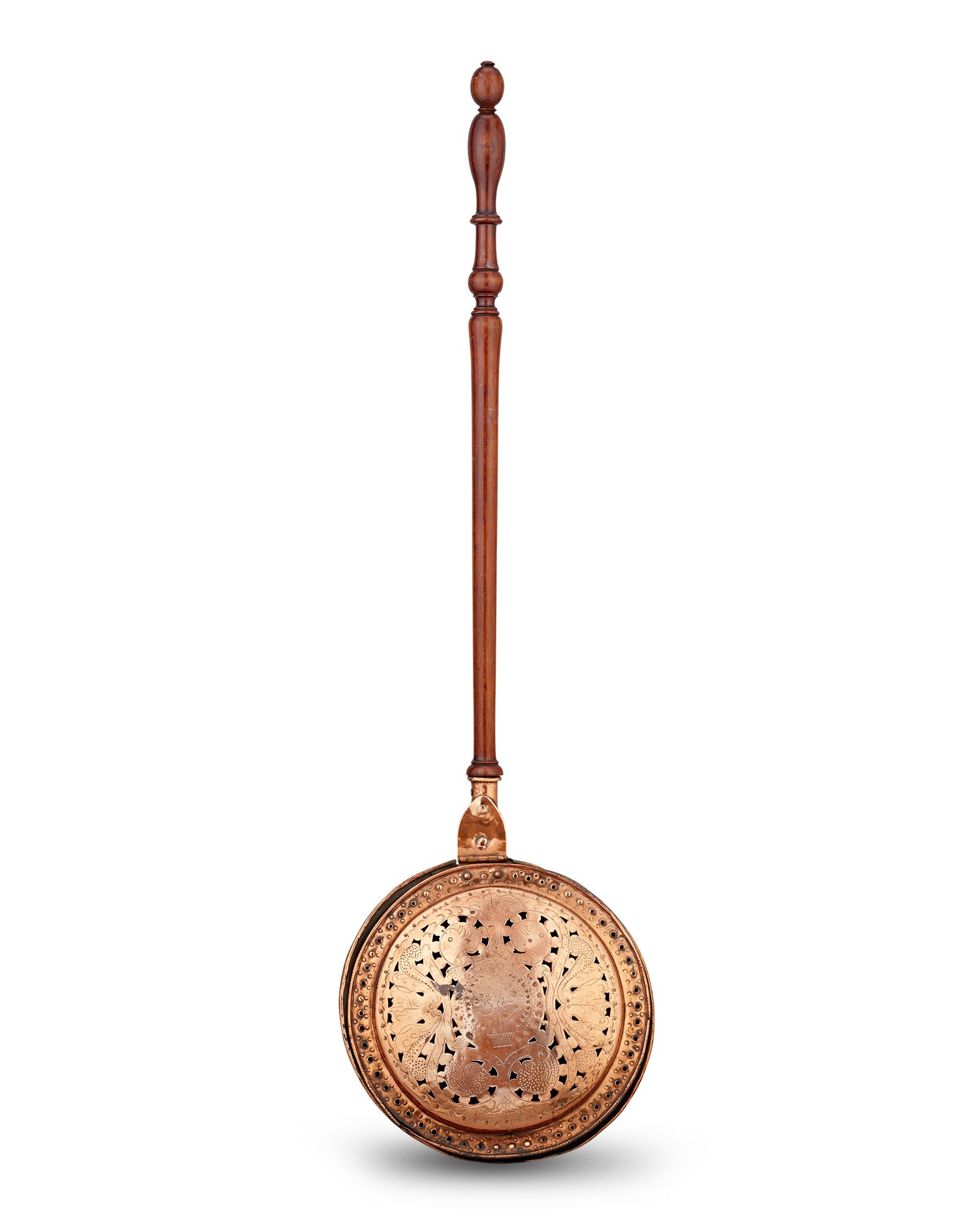 Spun Brass Bed Warmer
Early 19th century

This bed warmer exemplifies Federal period craftsmanship, a time when utilitarian objects were also works of art. The spun brass construction and precisely pierced lid demonstrate superior metalworking