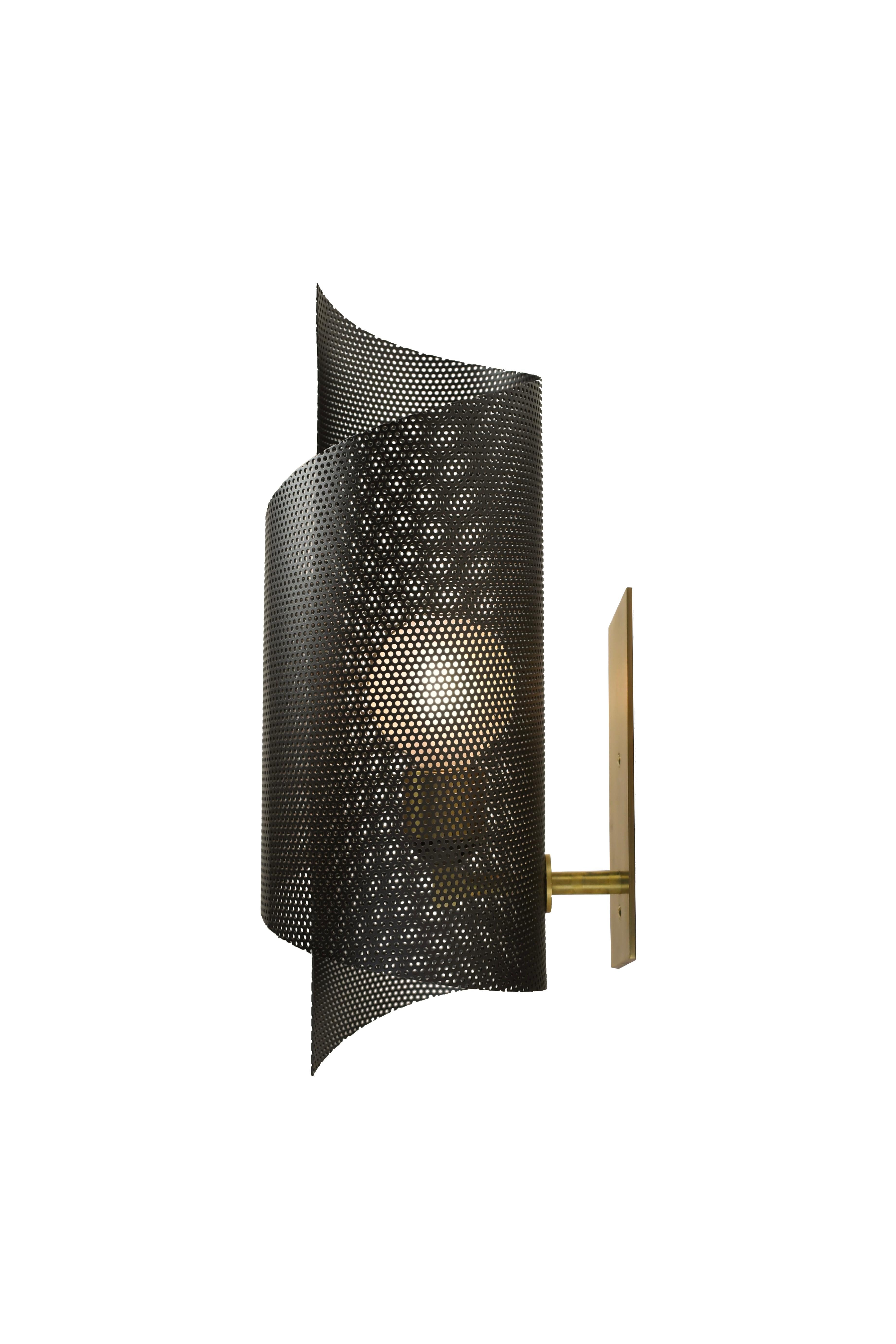 The Spun Tulle wall sconce is a graceful, commanding piece of sculpture that works well in both modern and transitional interiors. Shown here in our matte black enamel and natural brass hardware. Available in any of our 36 enamel colors and 7 metal