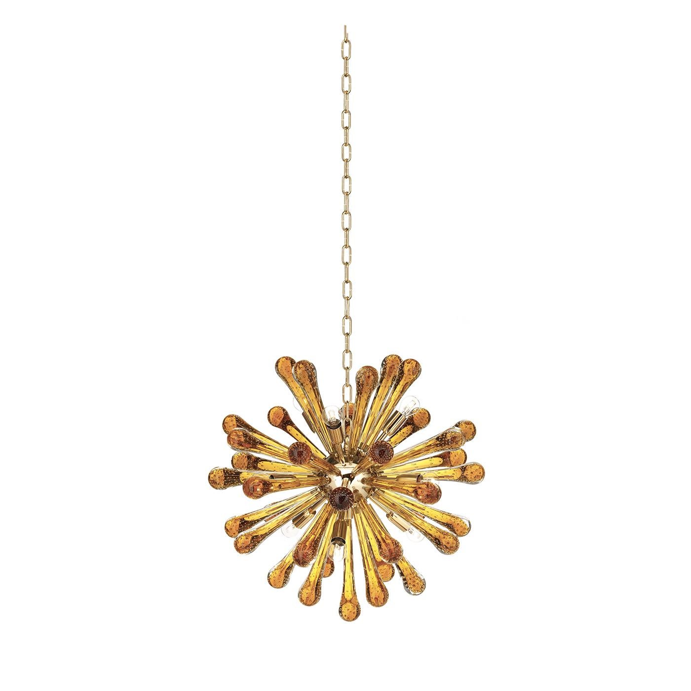 The decoration of this colorful and striking chandelier is entirely made of Murano mouth-blown glass, suspended from the ceiling on a metal chain. The central core of the piece is a metal sphere on which nine E14 x W LED lightbulbs on conical