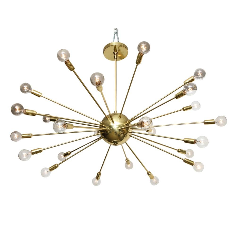 Sputnik chandelier, brass, 24 lights. Medium scale satellite form chandelier with a spherical center and 24 arms of several different lengths. Professionally refinished and completed updated for immediate installation. Brass post measures 14.5