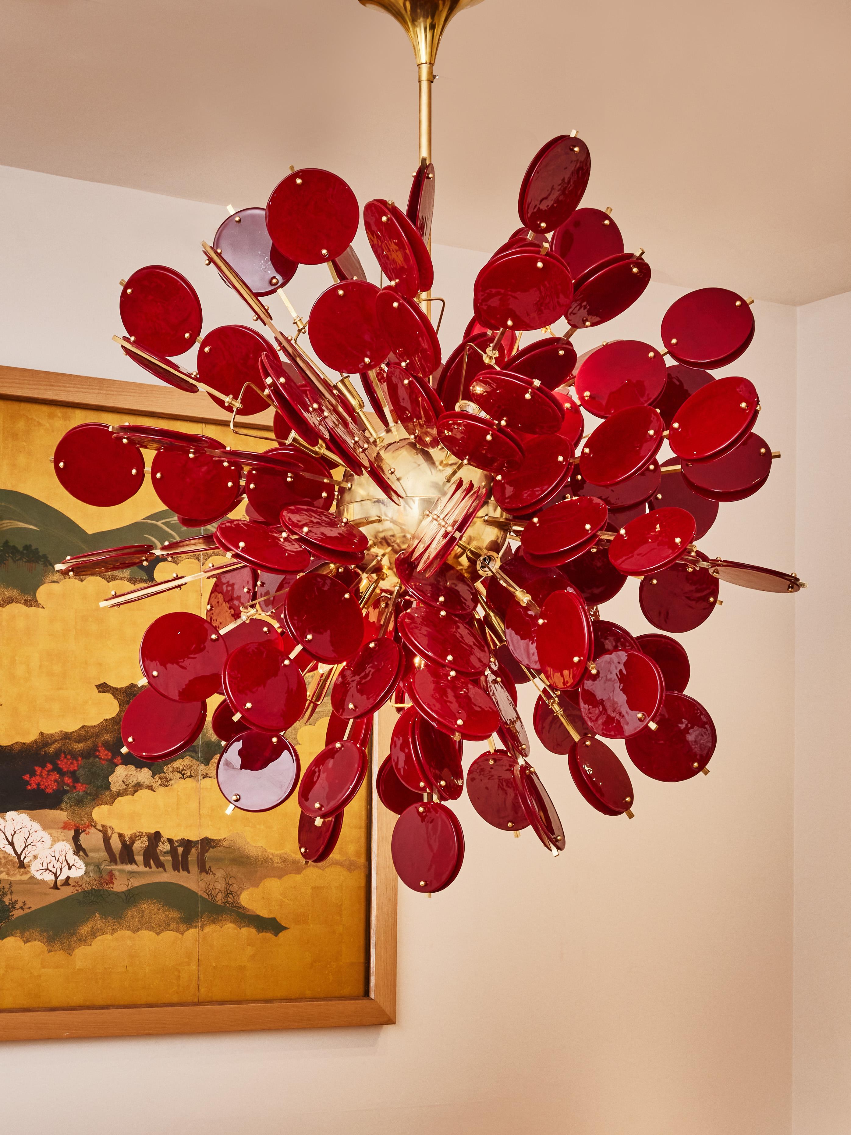 Stunning sputnik chandelier in brass with burgundy tainted Murano glass pellets.
Creation by Studio Glustin.
Italy, 2023