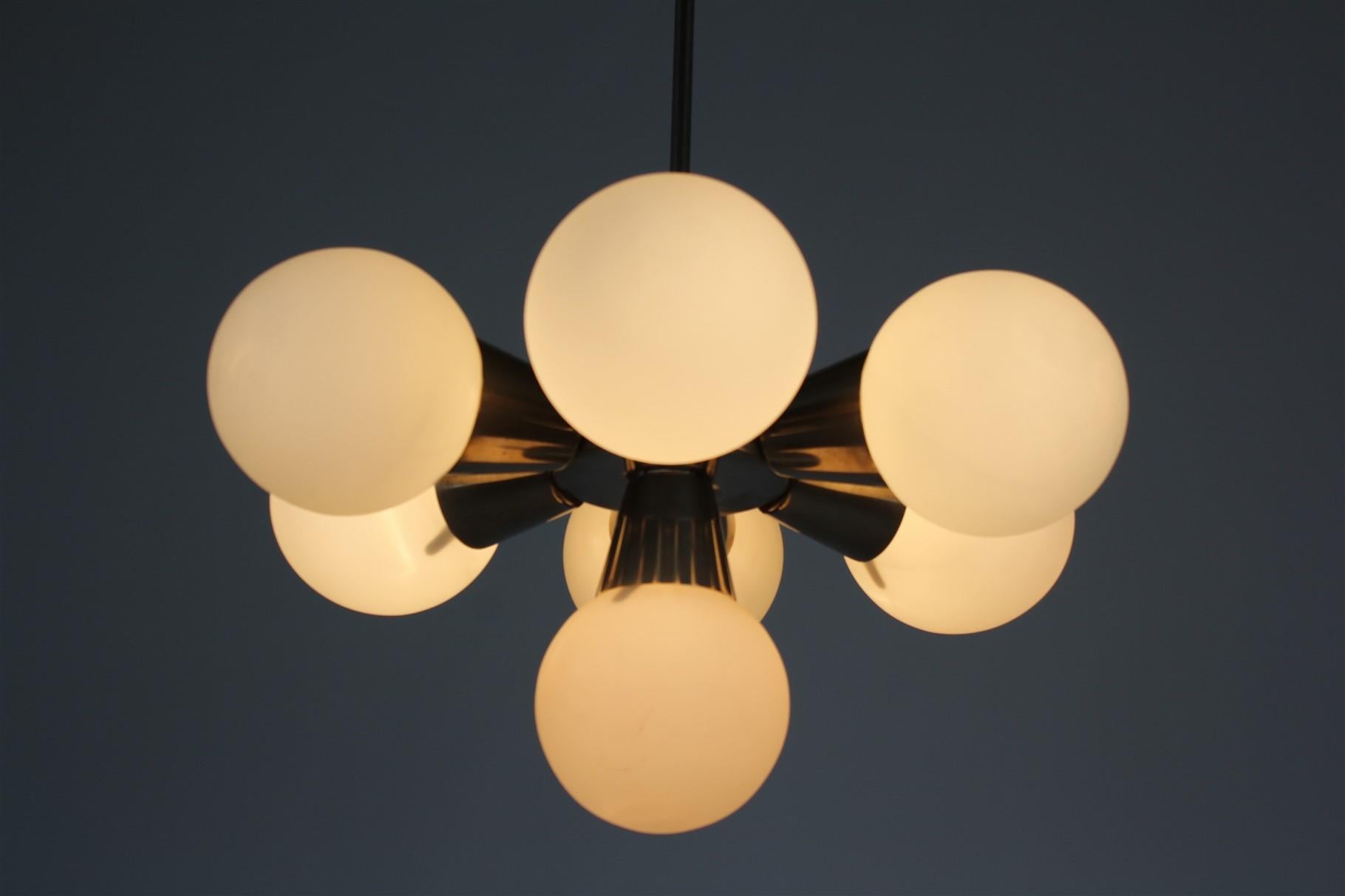 Mid-century Sputnik chandelier. Made in former Czechoslovakia by Kamenický Šenov in the 1970s. Made of chrome plated metal and milk glass. Features 7 x E14 light fittings.