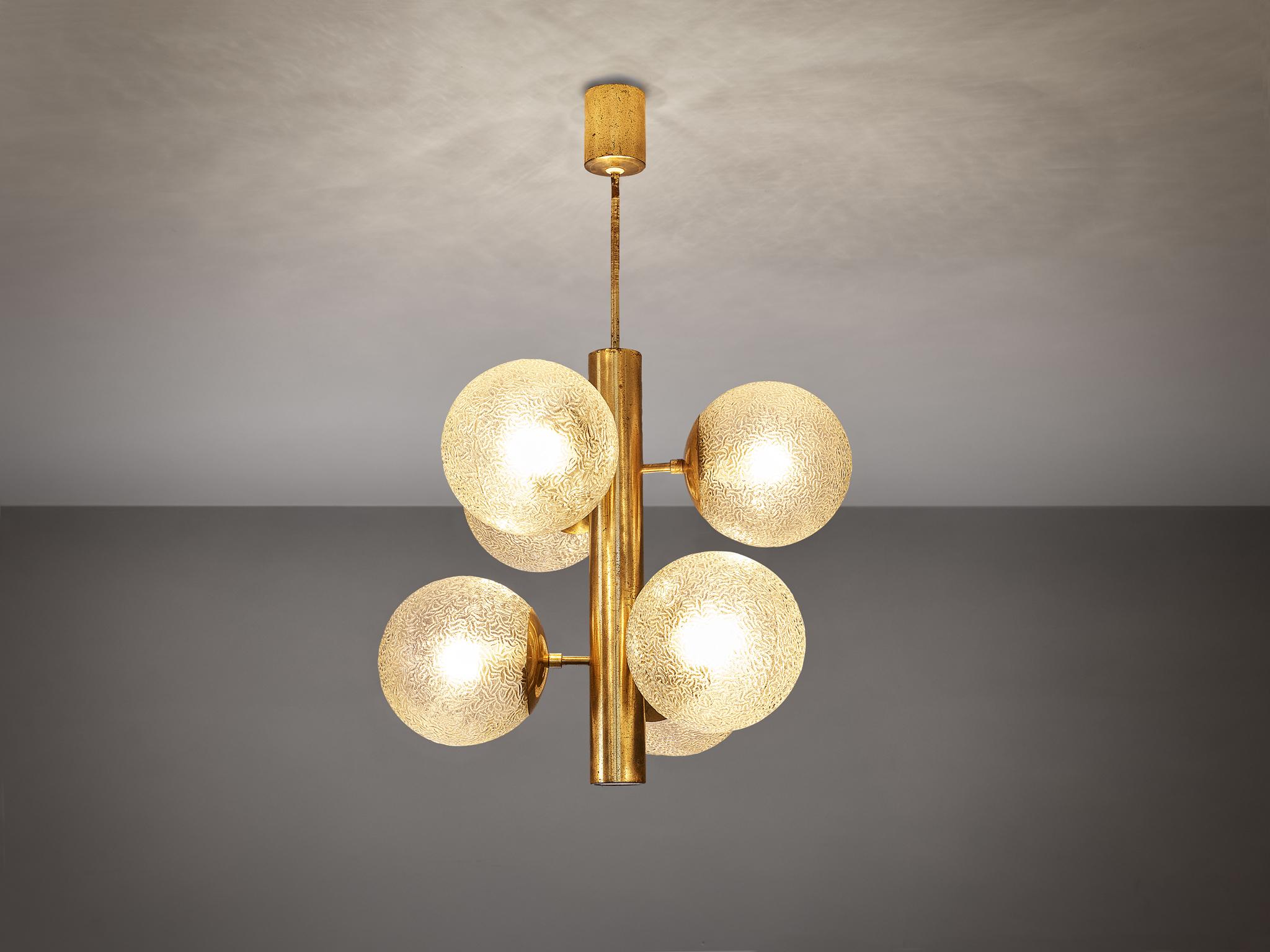 Sputnik chandelier, in brass, metal, textured glass, Europe, 1970s. 

This layered Sputnik chandelier features six wonderful textured glass globes. The chandeliers consist of a stunning, elegant fixture with six arms. On each arm, a glass sphere is