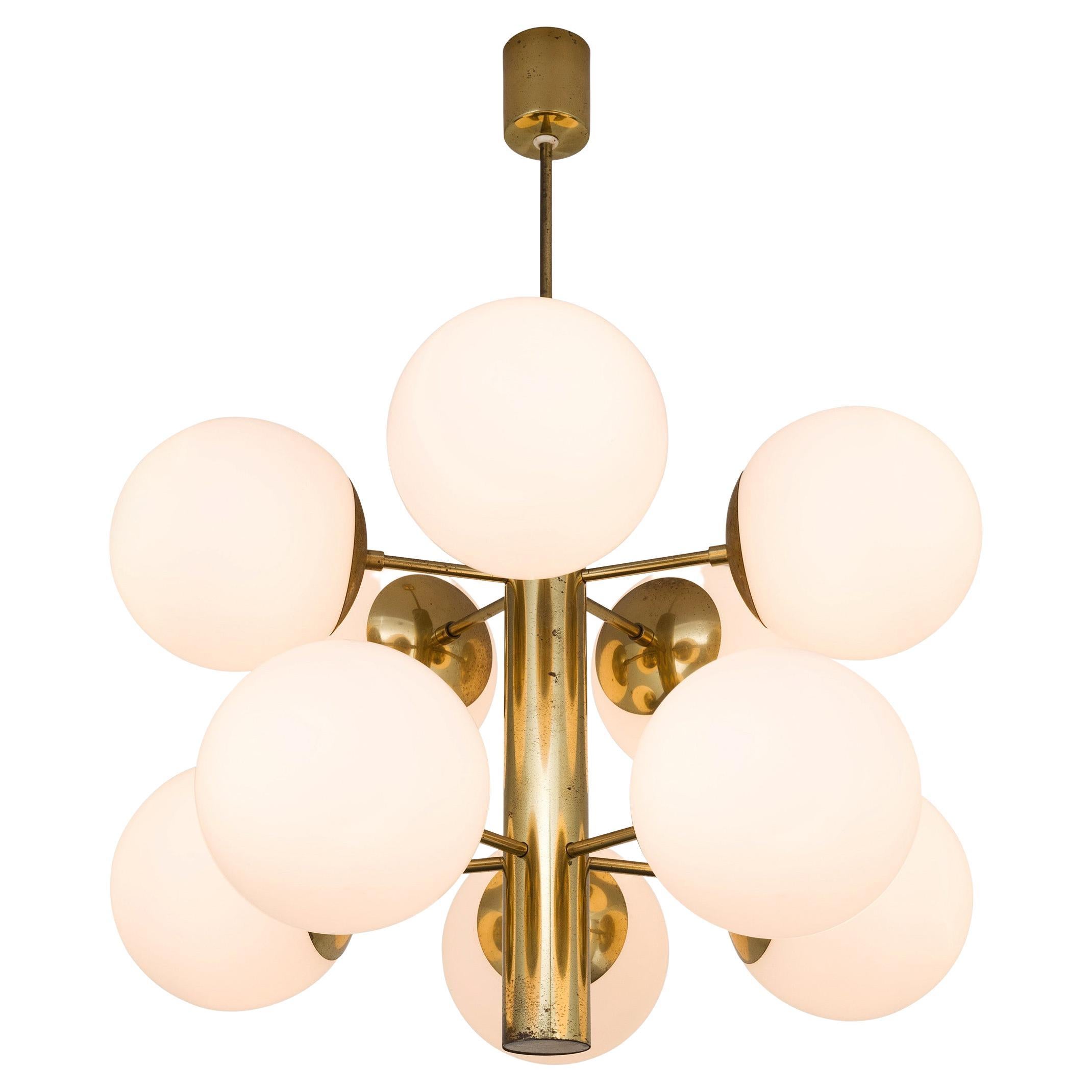 Fabulous brass sputnik chandelier with frosted glass globes. at 1stDibs