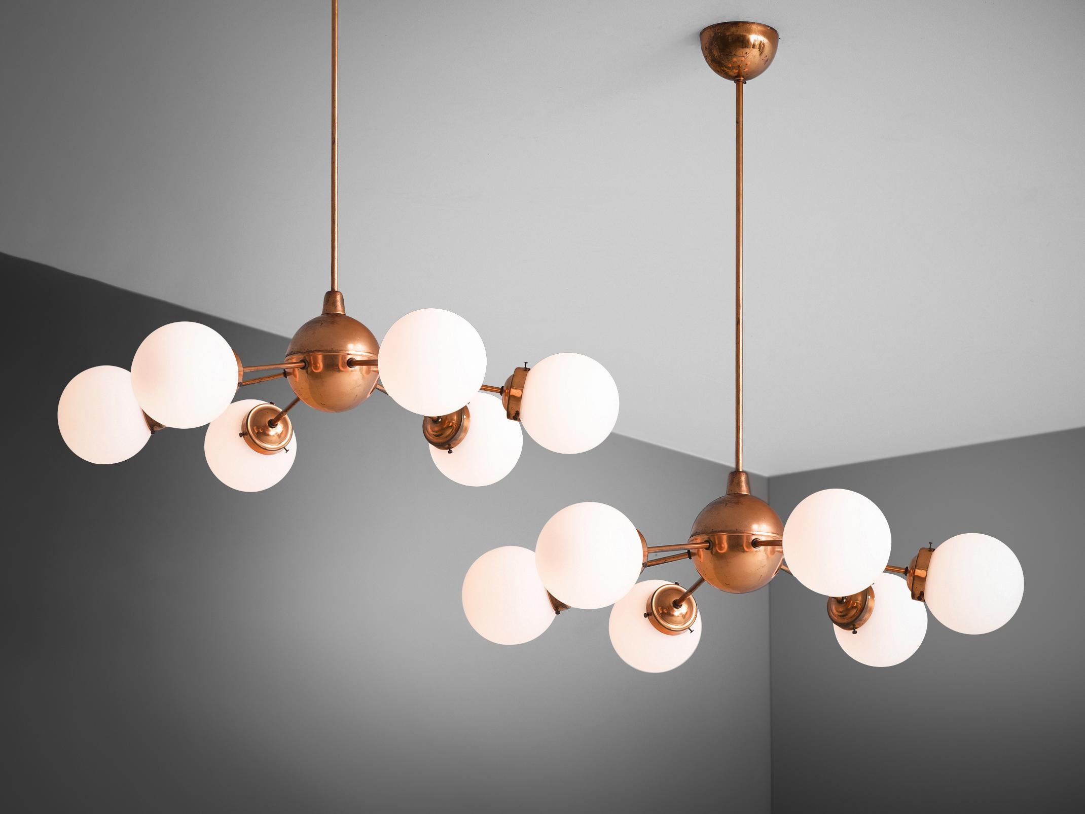 Sputnik chandeliers, opal glass, copper, Europe, 1970s

Beautiful chandeliers with a bright copper body and opal glass shades. These sputnik chandeliers feature six arms each with a opal glass sphere. The stern and canopy are executed in matching