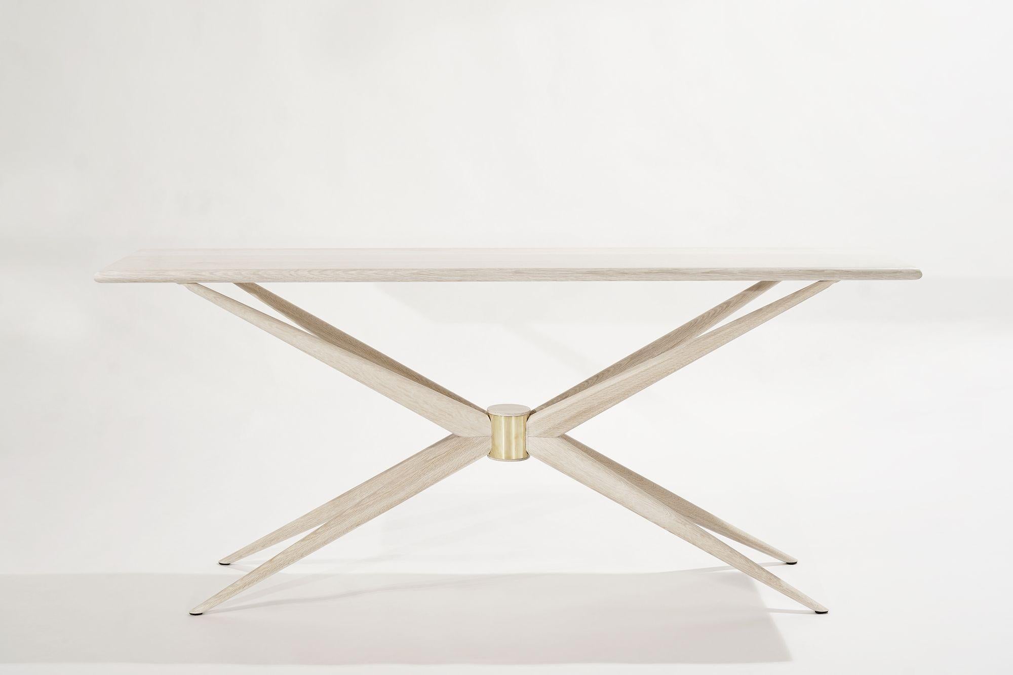 Danish design blends simple aesthetics with lively shapes. The Sputnik Console is inspired by Hans Wegner, and it evokes different energy from every angle. Star-shaped legs appear delicate and uplifting from the side. Head-on, the central brass