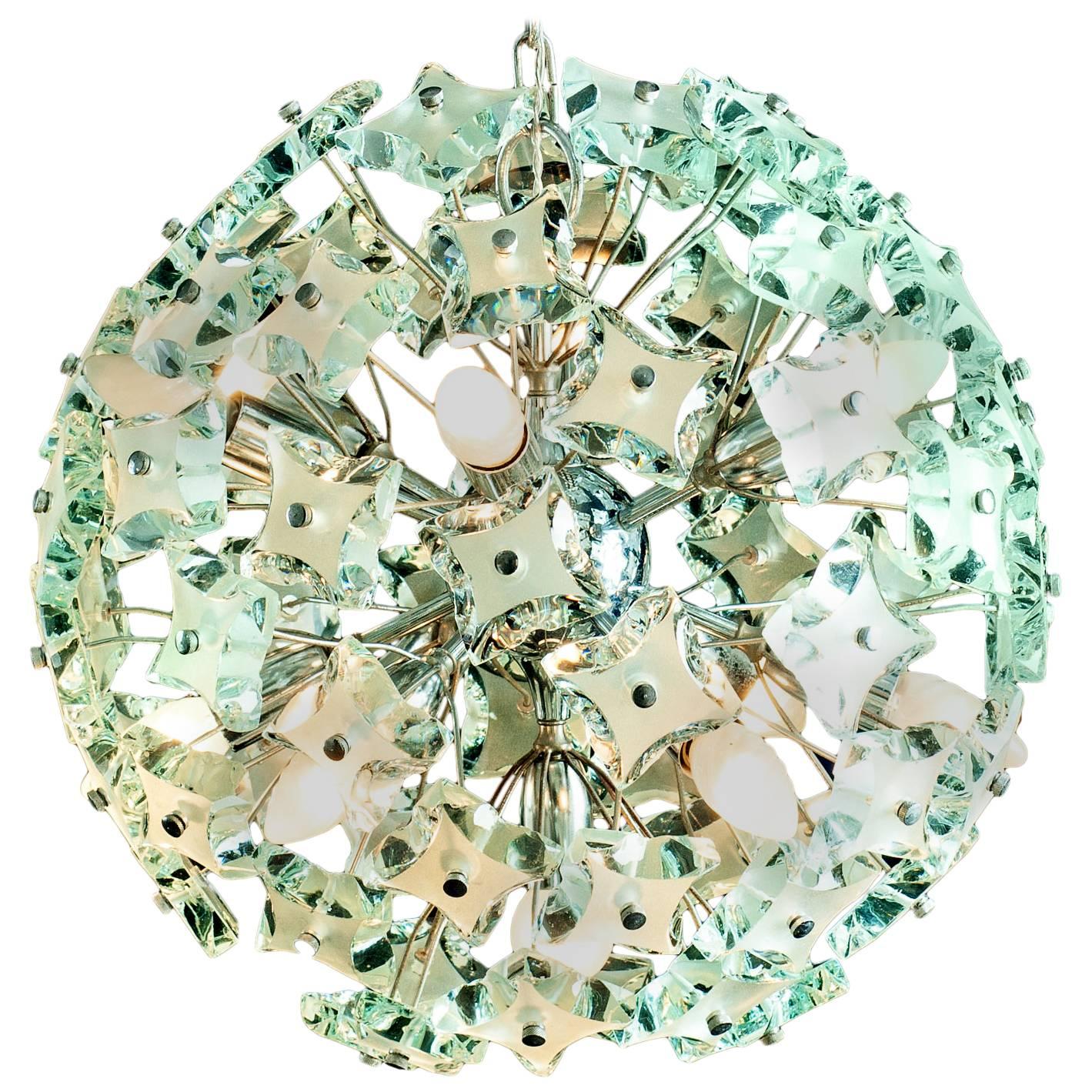 Amazing midcentury Murano glass sputnik chandelier in the style of Fontana Arte, circa 1960's. Chrome frame with green colored cut-glass.