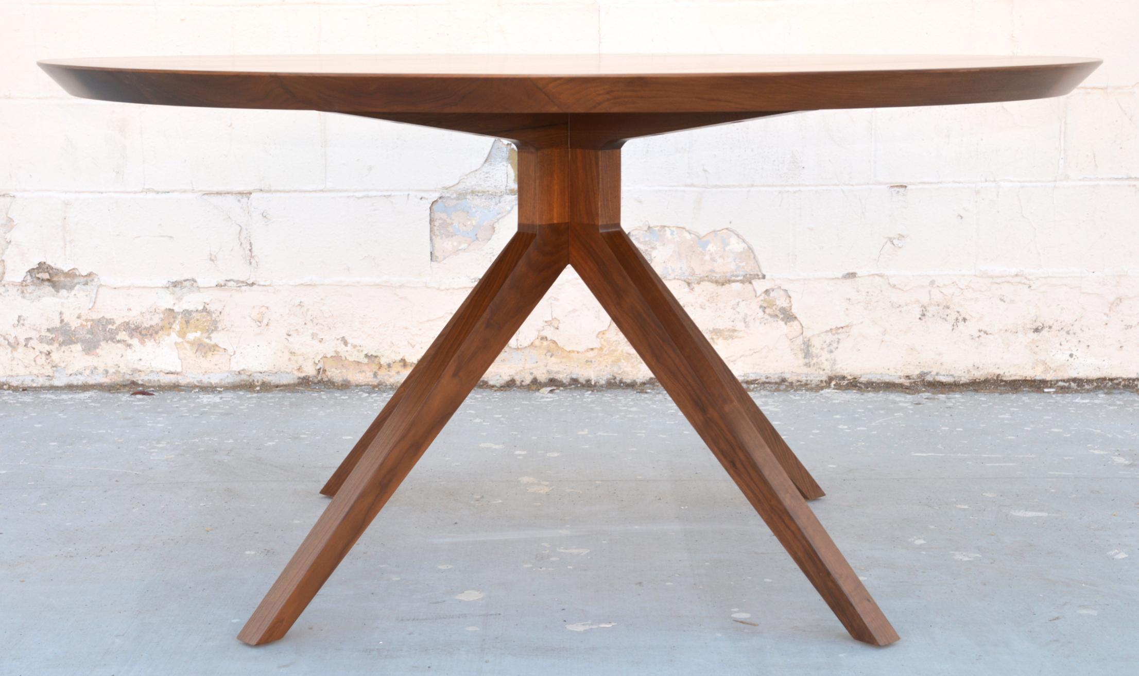 Custom dining table in solid walnut. Shown here in in a 60
