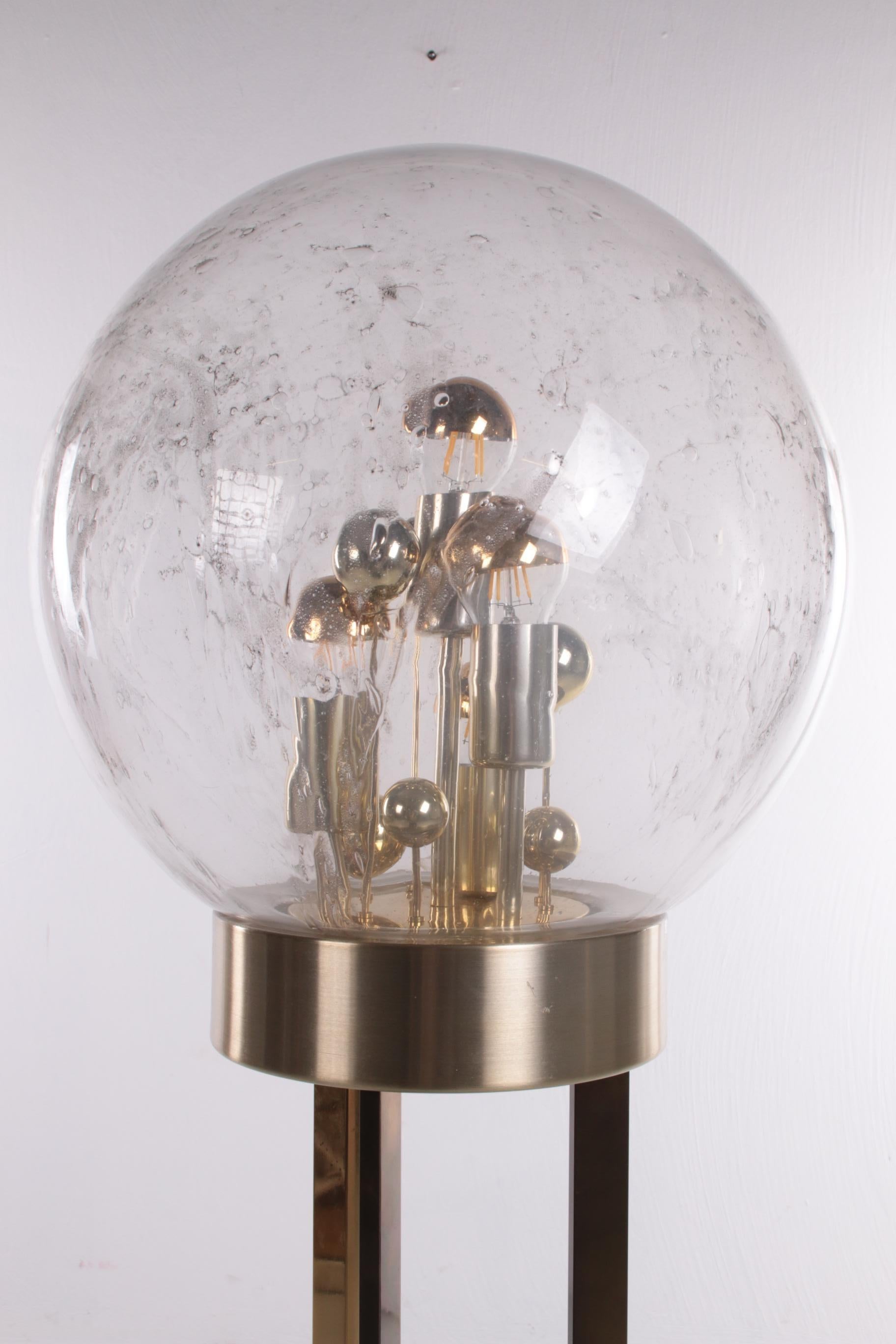 Sputnik floor lamp by Doria Leuchten, Germany, 1970s.


This beautiful Doria floor lamp is originally from 1970.

A glass sphere with air bubbles as the shade of the lamp.

The gold accents give this lamp a classy look.
1 Sustainable: