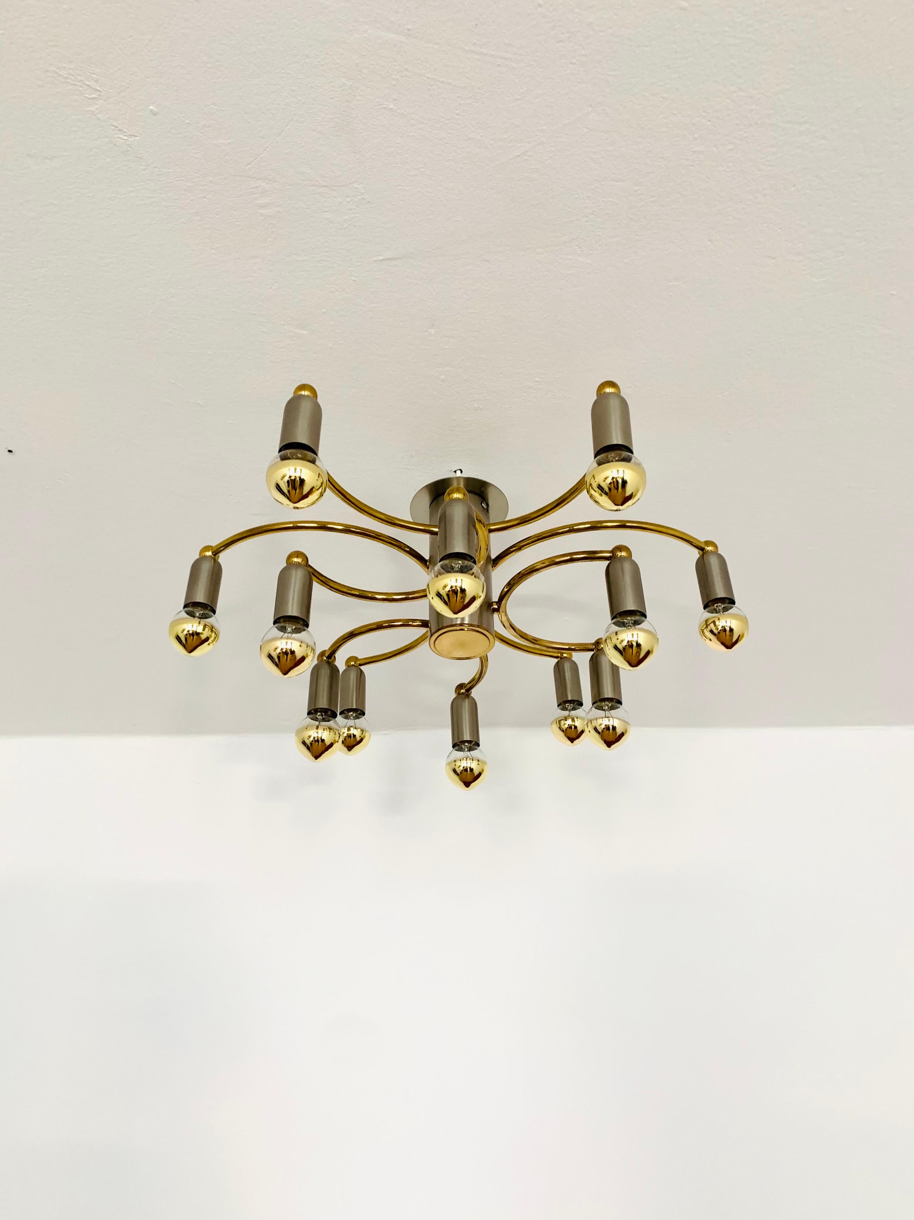 Very rare Sputnik ceiling lamp from the 1960s.
Very high quality and solid workmanship.
An enrichment for every home.
The design creates an exciting, fiery play of light.

Manufacturer: Brothers Cosack

Condition:

Very good vintage condition with